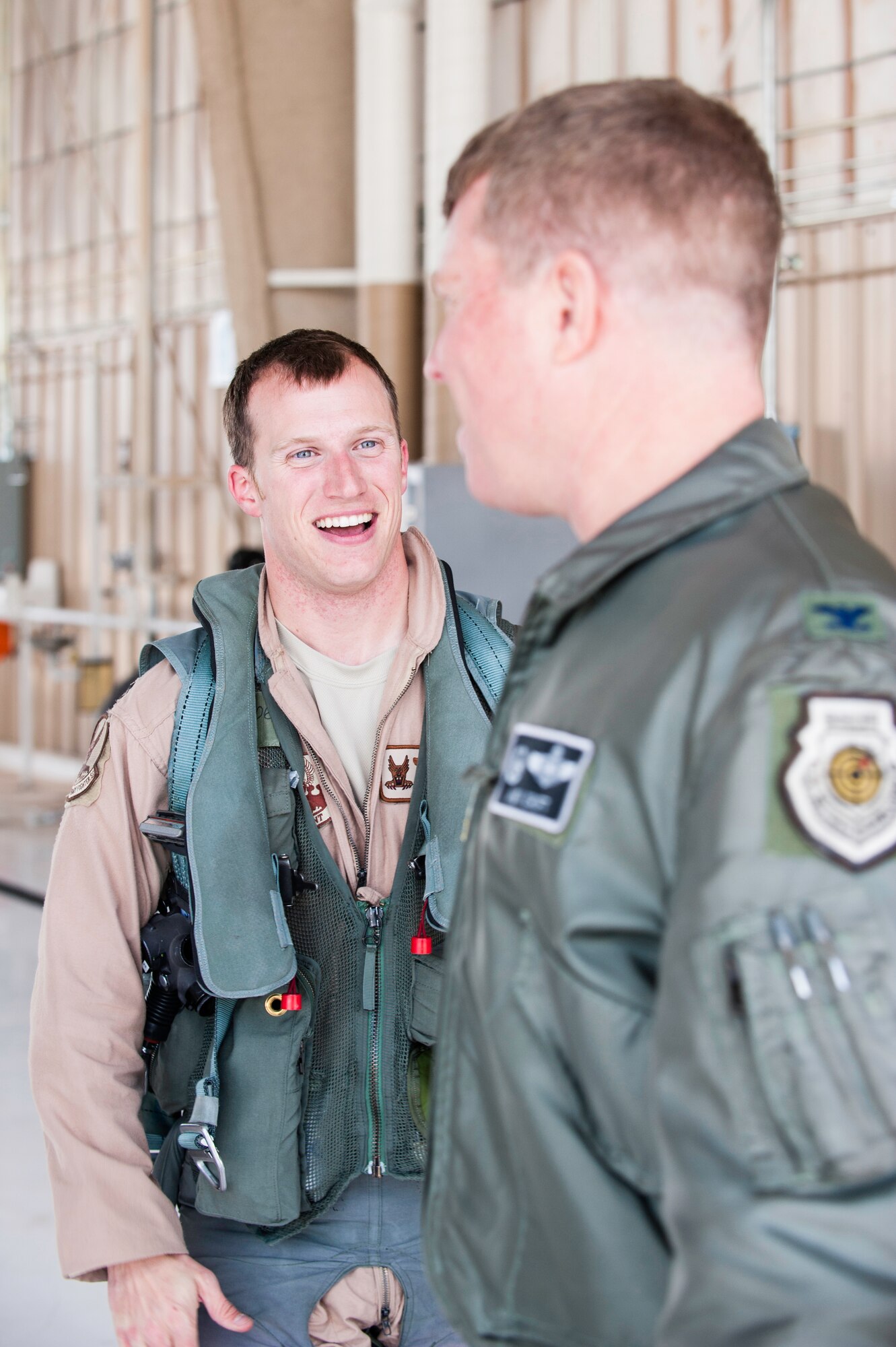 Captain Harrison Garlick 7th Fighter Squadron F-22 Raptor pilot, is greeted by Col. Andrew Croft, 49th Wing commander, after landing on the Holloman AFB, N.M., flightline Jan. 28.  The aircraft and around 200 personnel returned Monday from a 9-month deployment to Southwest Asia ensuring regional security and joint tactical air operations.  (U.S. Air Force photo by 1st Lt. Stephanie Schonberger/Released)