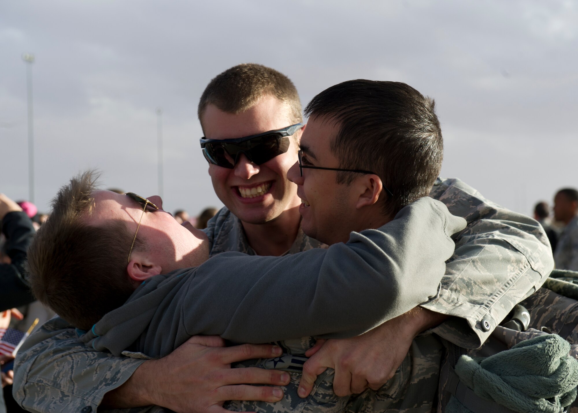 Airmen from the 7th Fighter Squadron and 49th Maintenance Group reunite with friends and family on the Holloman Air Force Base, N.M. flightline, Jan 28. F-22 Raptors and around 200 personnel returned Monday from a 9-month deployment to Southwest Asia ensuring regional security and joint tactical air operations. (U.S. Air Force photo by Airman 1st Class Michael Shoemaker/Released)