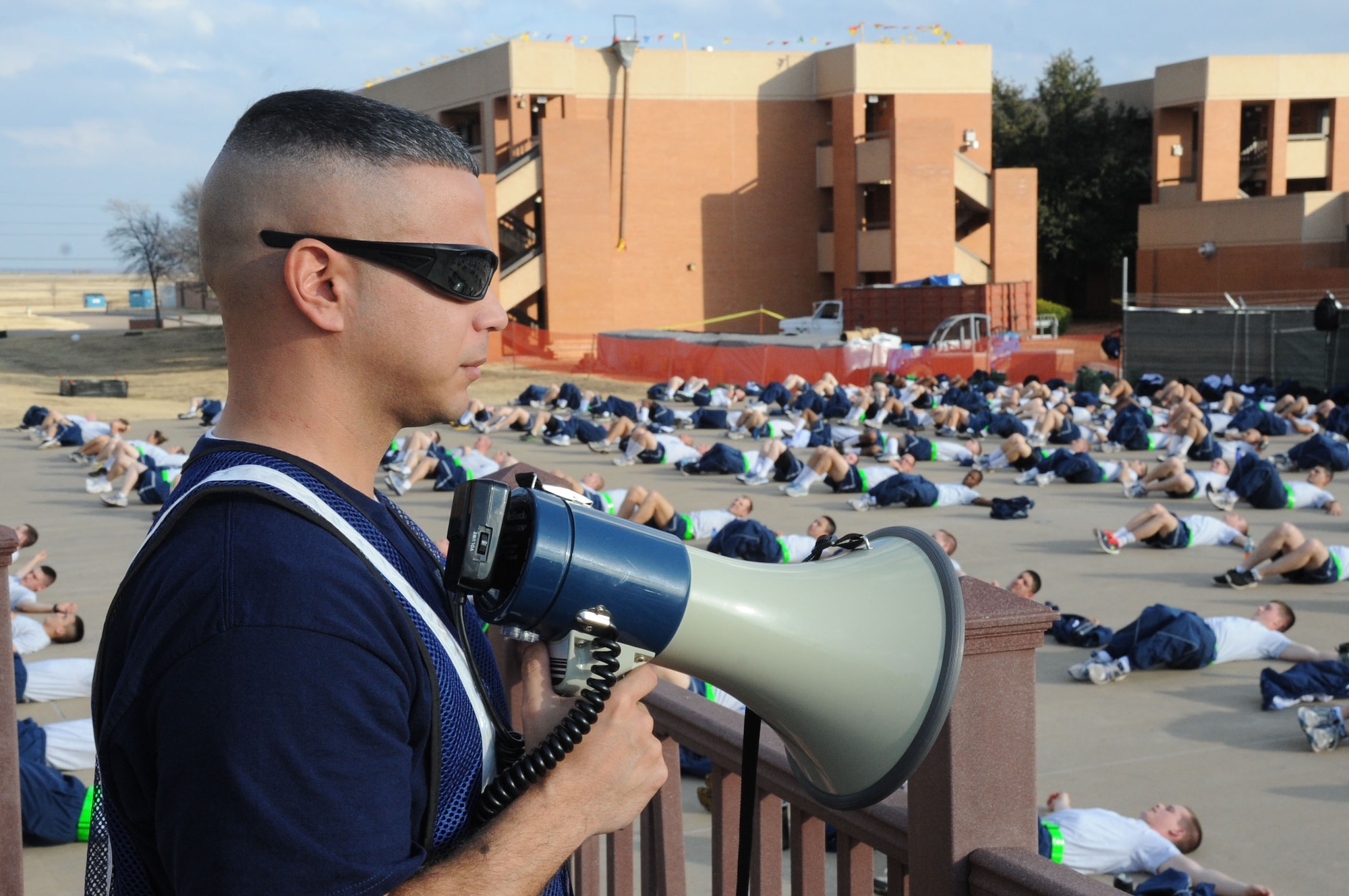 Staff Sgt. Eduardo Villareal, a Military Training Leader with the 366th Training Squadron, issues commands to the squadron for their physical training exercise. The 366th won Military Training Flight of the year for 2012.(U.S. Air Force photo by Airman First Class Jelani Gibson)
