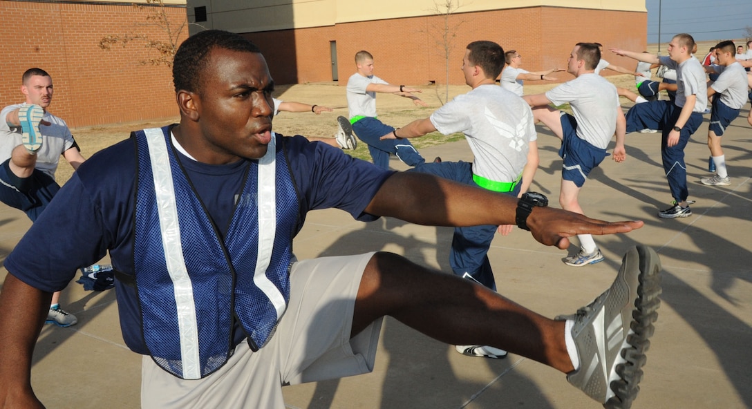 Staff Sgt. Edwin Mena, a Military Training Leader with the 366th Training Squadron, does physical training workouts with his students. Physical training usually takes place in the afternoon or morning depending on what shift the students work. (U.S. Air Force photo by Airman First Class Jelani Gibson)