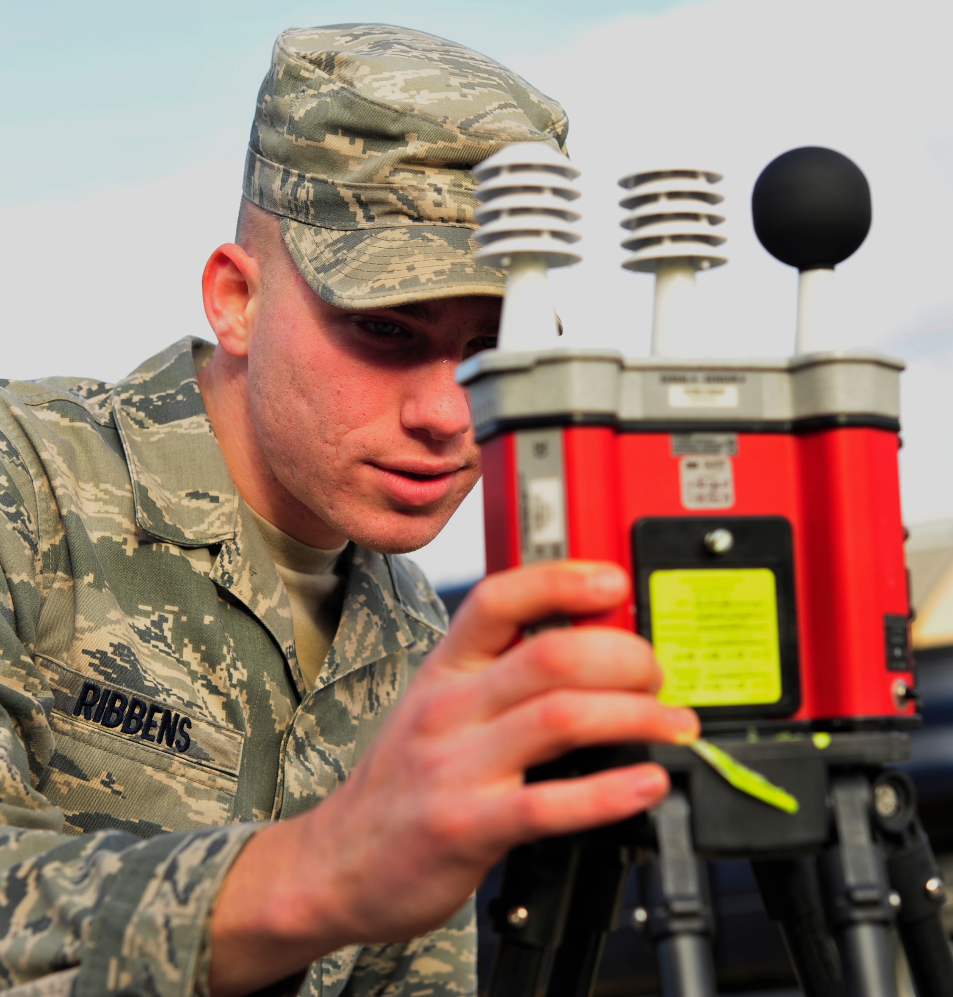 Senior Airman Alex Ribbens, a bioenvironmental engineer from the 779th Aerospace Medicine Squadron, examines the readings of a Wet Bulb Globe Temperature Index Jan. 23, 2013 on Joint Base Andrews, Md. The monitor is used to notify the base of heat flag conditions and measurement is required of those environmental factors that most nearly correlate with deep body temperature and other physiological responses to heat. (U.S Air Force photo/Airman 1st Class Erin O’Shea) 

