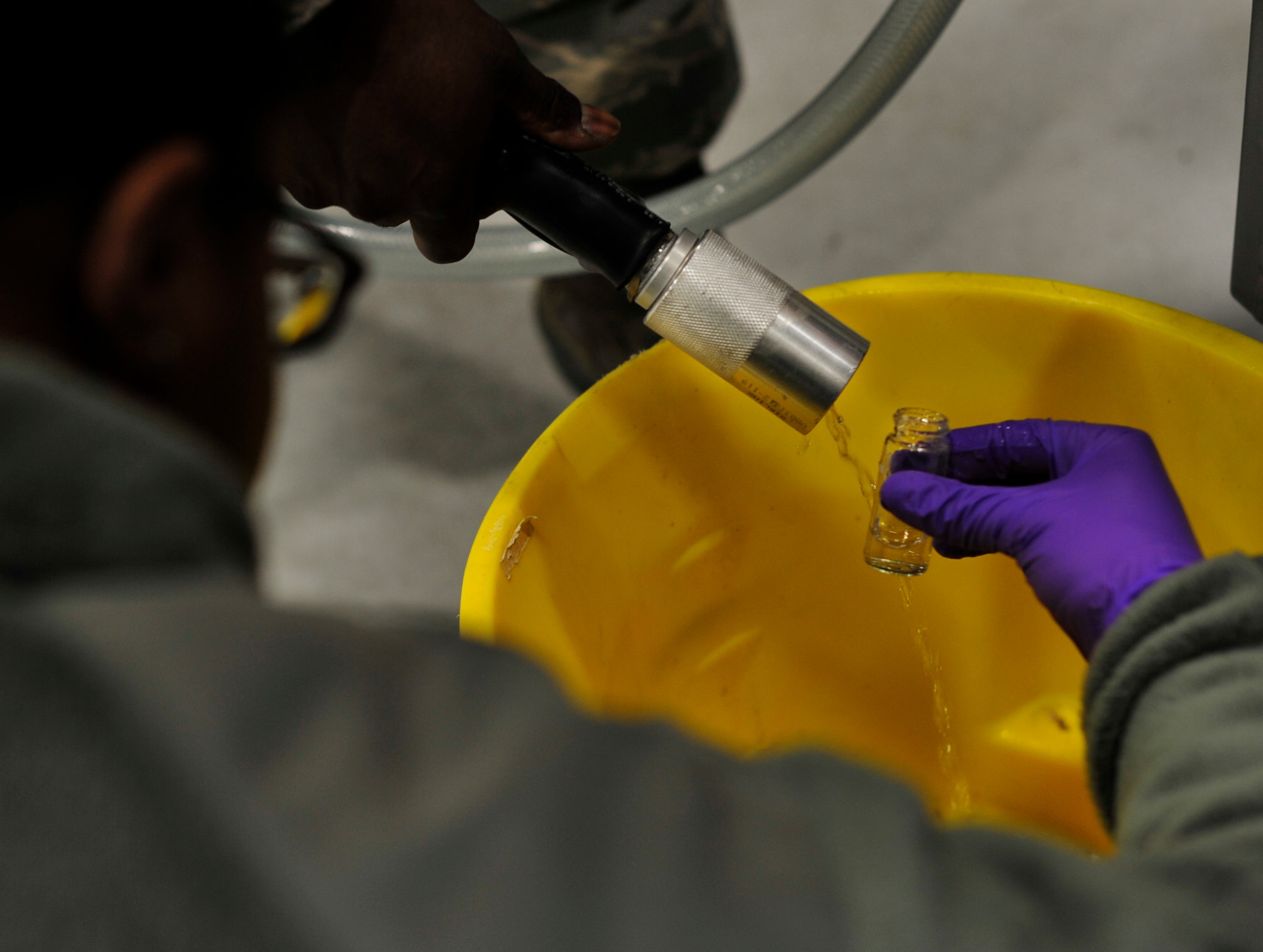 Airman 1st Class Alexandra Aloba, 779th Aerospace Medicine Squadron bioenvironmental engineering technician, fills up a vile to monitor the amount of chlorine in a water sample Jan. 23, 2013 at Joint Base Andrews, Md. Bioenvironmental engineers are required to visit specific locations for testing once a month. (U.S. Air Force photo/ Airman 1st Class Erin O’Shea)