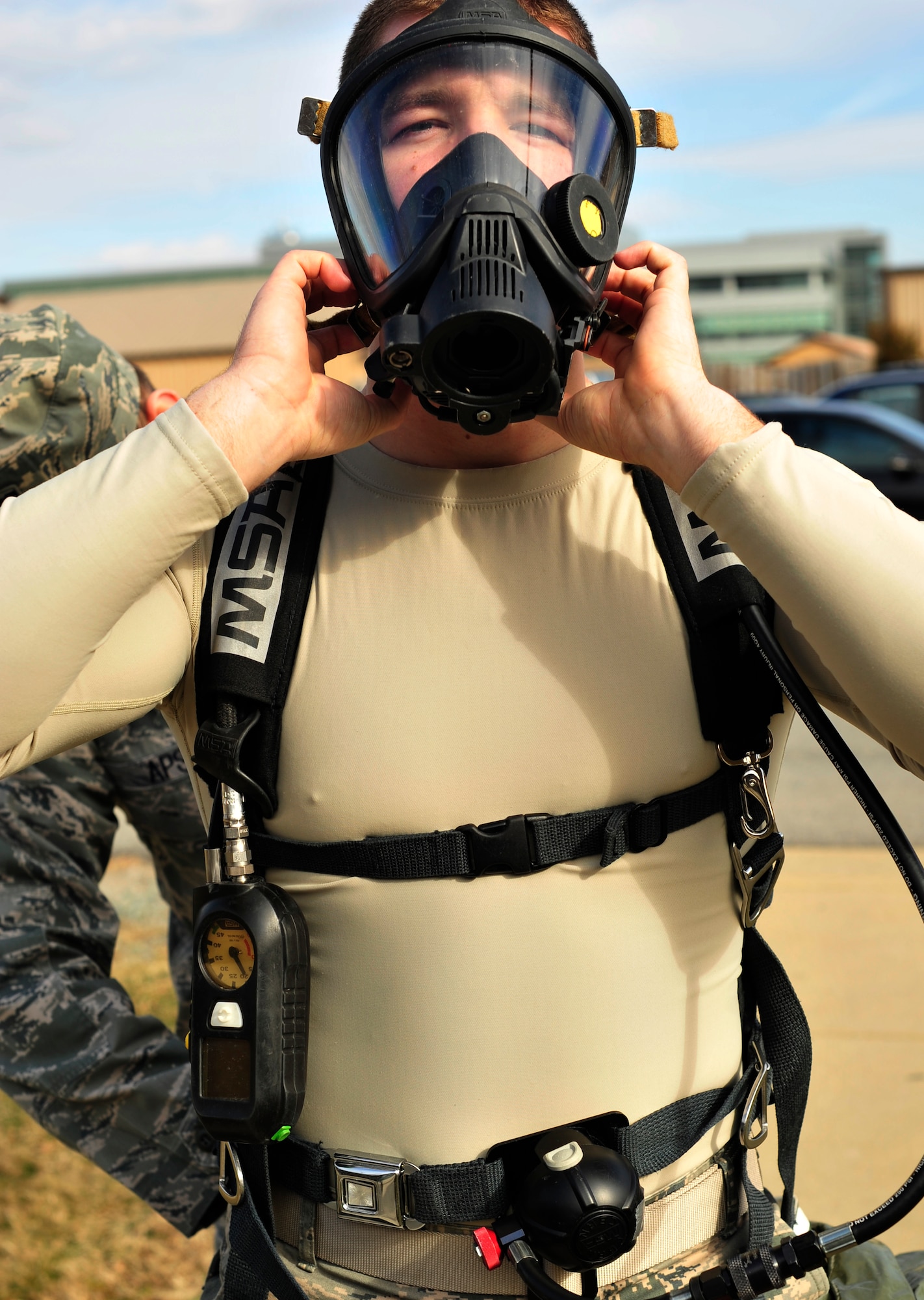 Airman 1st Class Jeremy Karcher, a bioenvironmental engineering technician from the 779th Aerospace Medicine Squadron, removes his respirator after a simulated vehicle clearing exercise Jan. 23, 2013 on Joint Base Andrews, Md. Bioenvironmental Engineers wear full protective gear during their exercises when checking for radiation. (U.S. Air Force photo/ Airman 1st Class Erin O’Shea) 