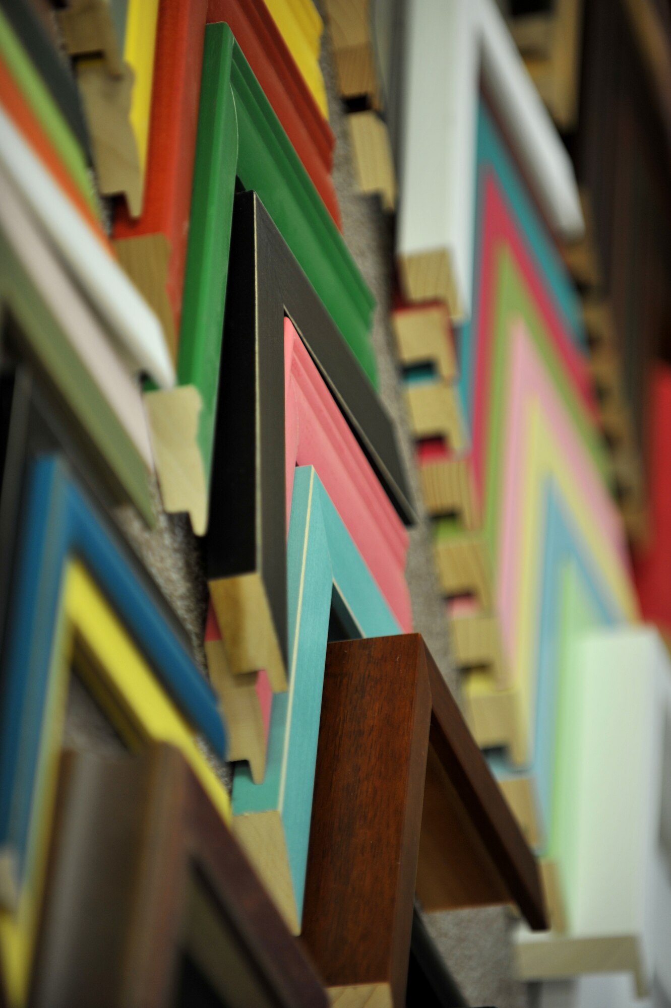 Picture frame samples hang on the wall at the Langley Air Force Base, Va., Arts and Crafts center, Jan. 14, 2012. In the coming months, Arts and Crafts will move into the renovated Youth Center to serve as the Community Commons, which will be a combination of the Community Center, Arts and Crafts, Information, Tickets and Tours, and parts of Outdoor Recreation. (U.S. Air Force photo by Staff Sgt. Katie Gar Ward/Released)