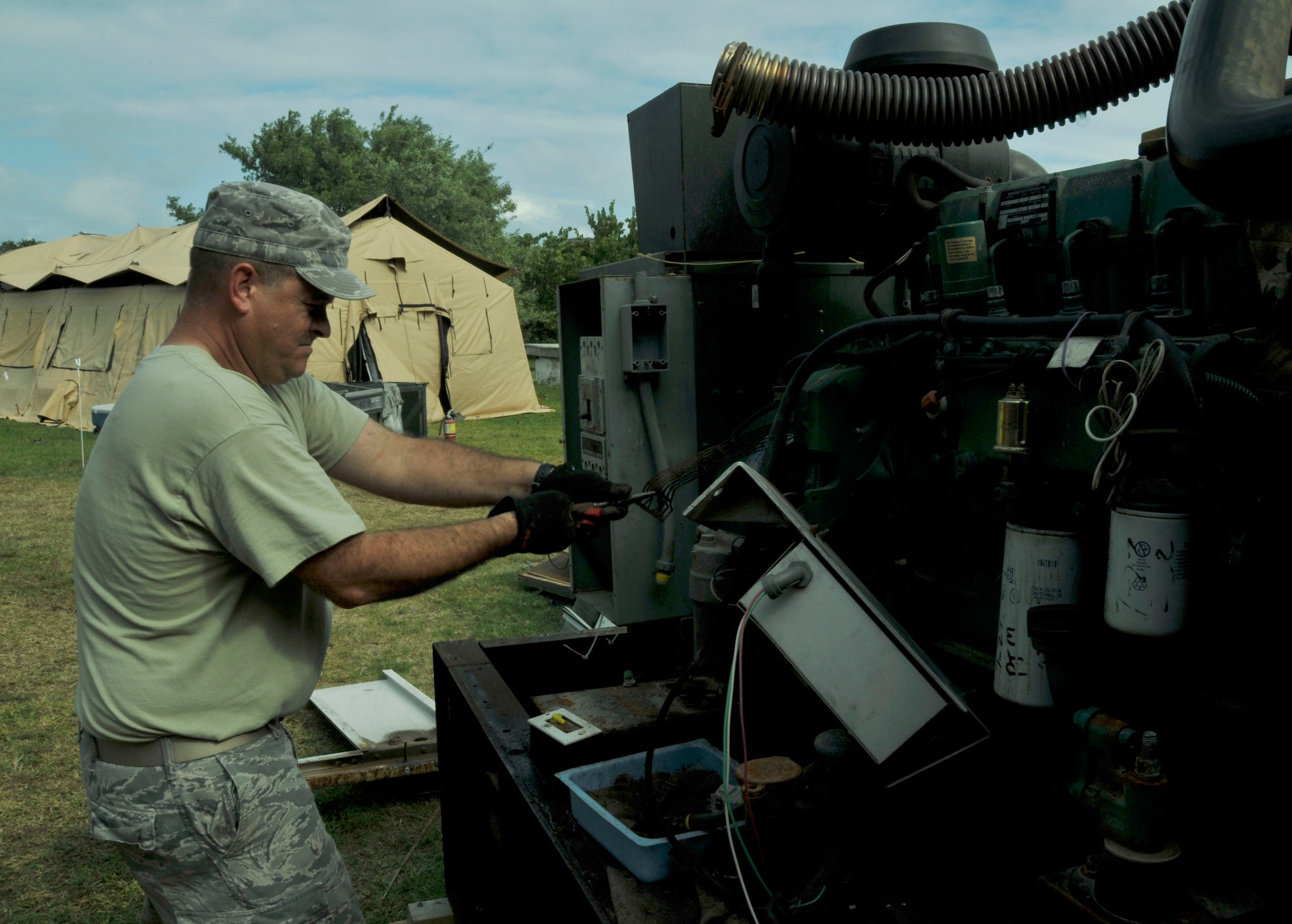 Tech. Sgt. Dennis Graham, 482nd Civil Engineer Squadron, takes apart a generator at Fort Jefferson in the Dry Tortugas National Park Jan. 17. Air Force reservists both active and retired from Homestead Air Reserve Base’s 482nd Civil Engineer Squadron gathered at Fort Jefferson over several days in January to participate in a maintenance project for the National Park Service. 15 active reservists, six retired reservists, and one civilian contractor set up shop at Fort Jefferson as a training mission. The main project of the training was the construction of four reinforced concrete bases for large, 24-ton restored cannons to replicate the historical weapon's footprint. (U.S. Air Force photo/Ross Tweten)
