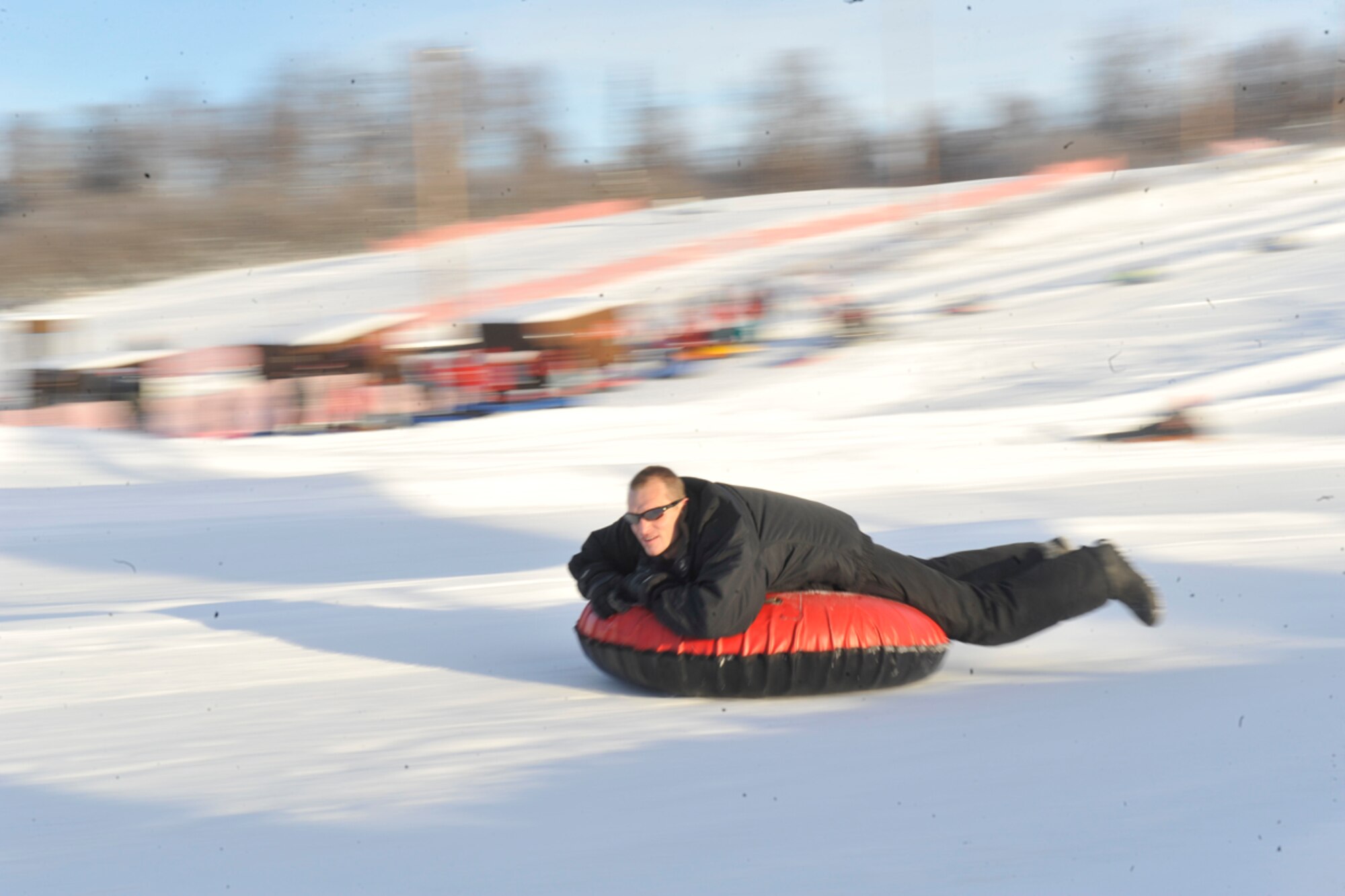 JOINT BASE ELMENDORF-RICHARDSON, Alaska -- Air Force Lt. Col. Kevin Dolata, 3rd Wing advanced programs chief, takes advantage of the holiday and enjoys some tubing at the Hillberg ski area Jan. 21. The ski area is available to all JBER community members. (U.S. Air Force photo/Airman Ty-Rico Lea)