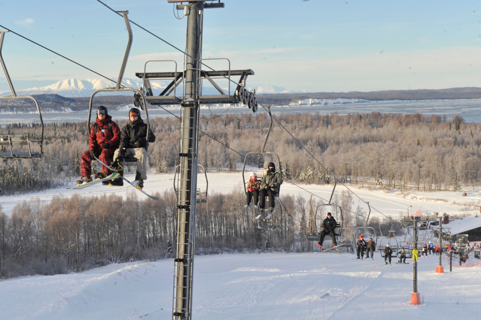 JOINT BASE ELMENDORF-RICHARDSON, Alaska -- Skiers and snowboarders make their way to the top of Hillberg using the ski lift Jan. 21. The ski area is available to all JBER community members. (U.S. Air Force photo/Airman Ty-Rico Lea)