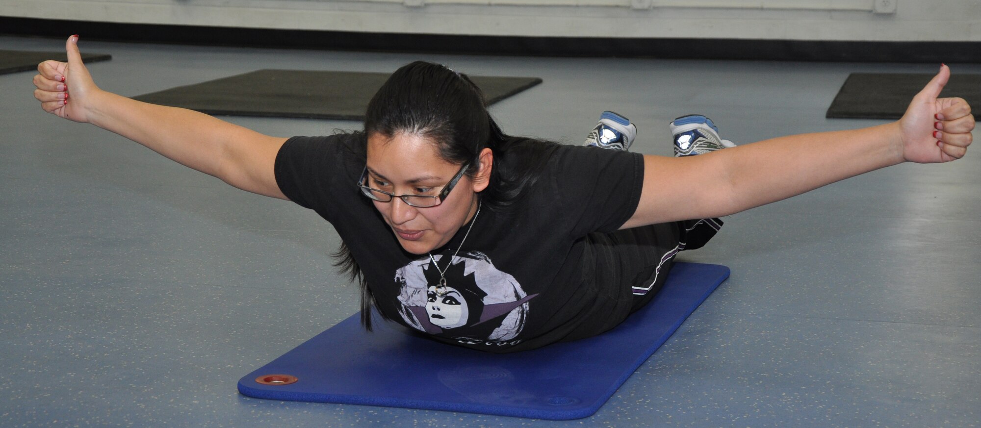 GOODFELLOW AIR FORCE BASE, Texas – Maria Dossey, 316th Training  Squadron training technician, works out at the “superman station” for the circuit training portion of the Better Body. Better Life. program at the Mathis fitness Center here, Jan. 17. Dossey was able to hold this pose the entire time she was at the station. (U.S. Air Force photo/ Airman 1st Class Joshua Edwards)