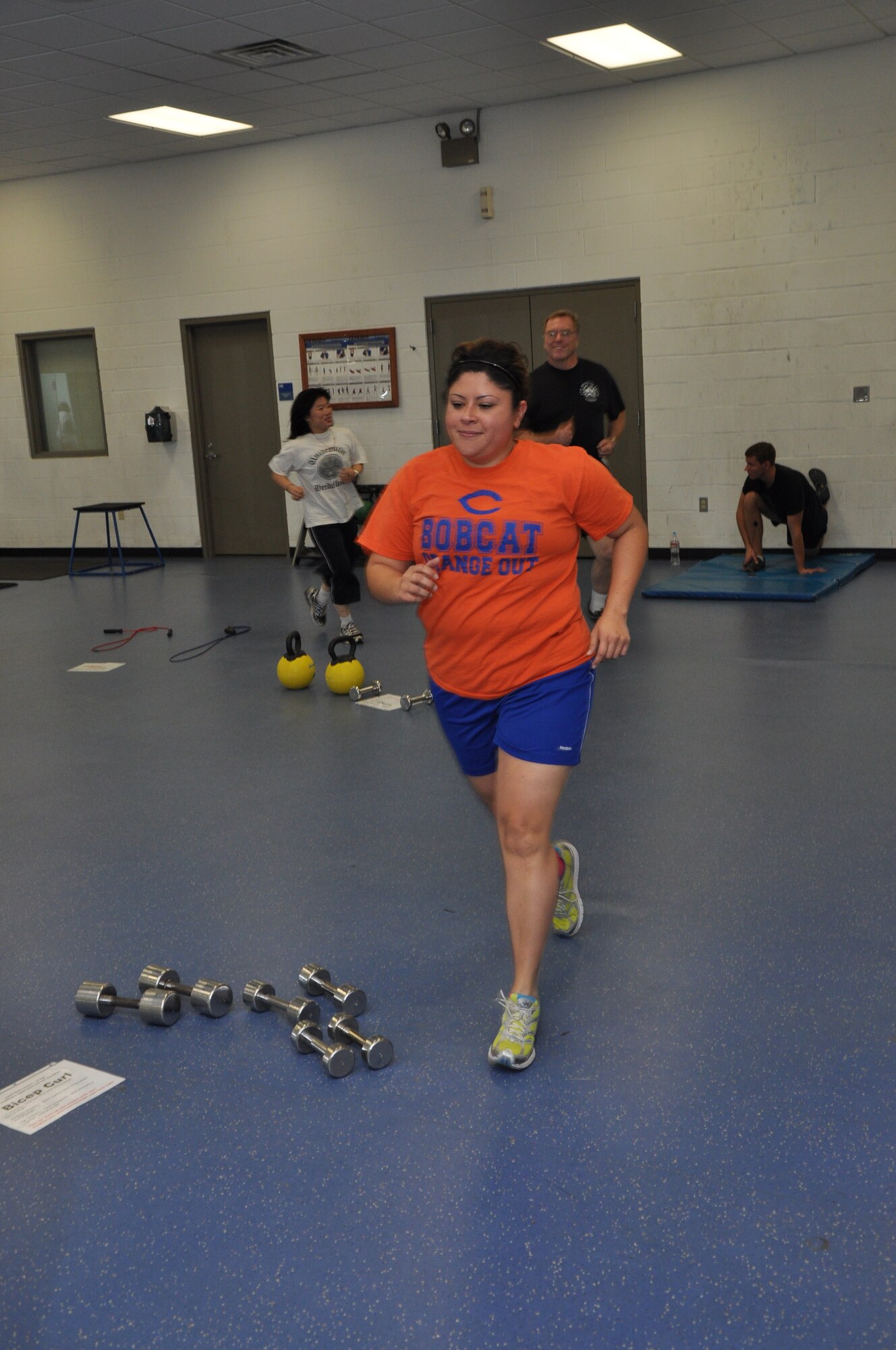 GOODFELLOW AIR FORCE BASE, Texas – Monica Barquera, 17th Medical Support Squadron referrals clerk, runs a lap around the physical training room in the Mathis Fitness Center here, Jan. 17. Barquera and other members of the Better Body. Better Life. program ran three laps around the room before doing circuit training. (U.S. Air Force photo/ Airman 1st Class Joshua Edwards)
