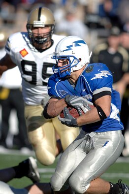 Air Force wide receiver Chad Hall tries to juke past an Army defender during the Falcons-Black Knights game at Falcon Stadium Nov. 3, 2007. Hall accounted for 275 yards rushing, 19 yards receiving and one rushing touchdown in the Falcons' 30-10 victory. Hall signed with the San Francisco 49ers in November 2012 and is scheduled to appear with them at Super Bowl XLVII. (U.S. Air Force photo/Mike Kaplan)