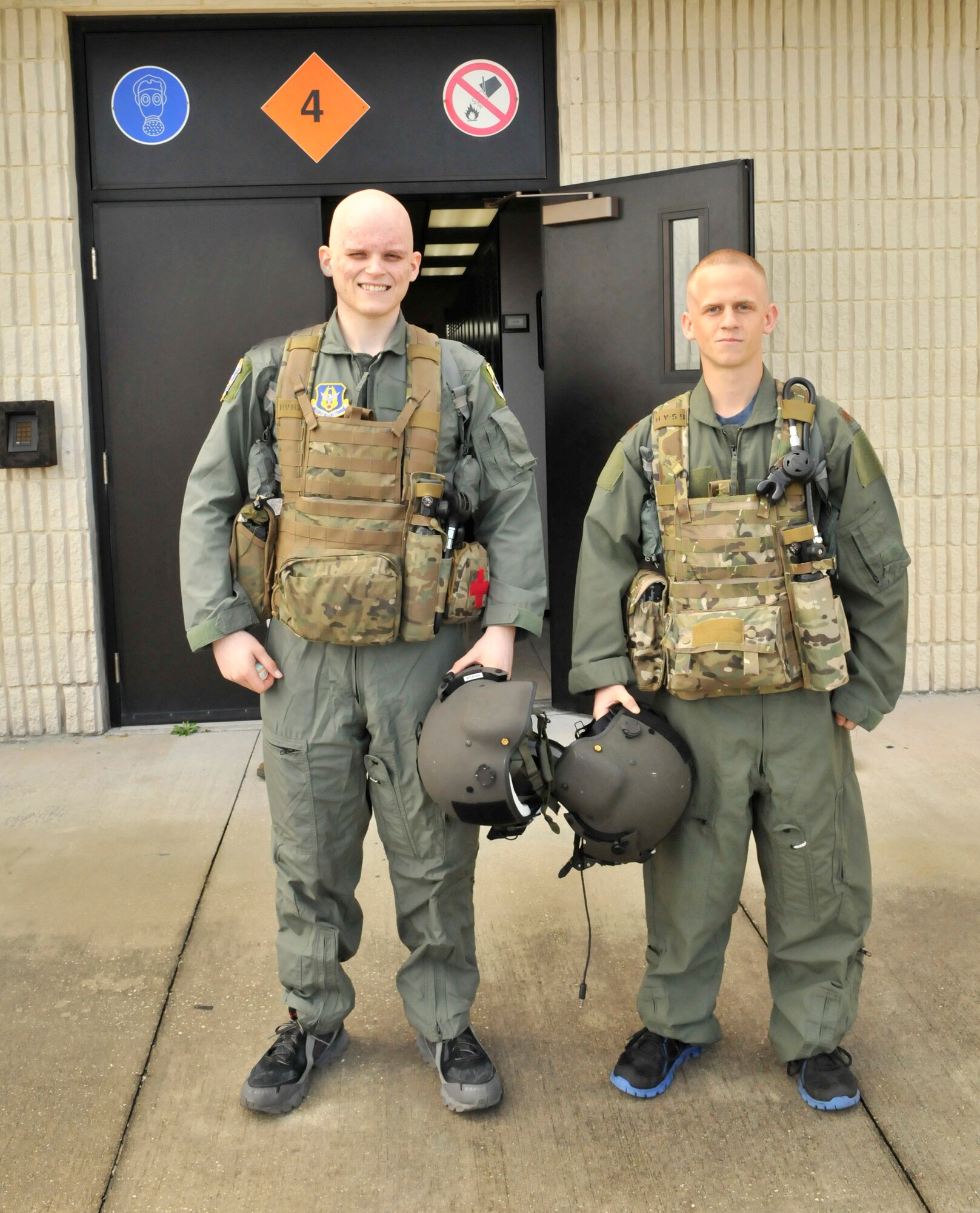 Coleton Wells on left along with his best friend Zachary Kalish, both Air Force Junior ROTC cadets are all suited up ready to join Airmen from the 920th Rescue Wing on a local training flight aboard a HH-60G Pave Hawk rescue helicopter. Wells is in a battle for his life, he is fighting stage 4 cancer. (U.S. Air Force photo/Tech. Sgt. Peter Dean) 