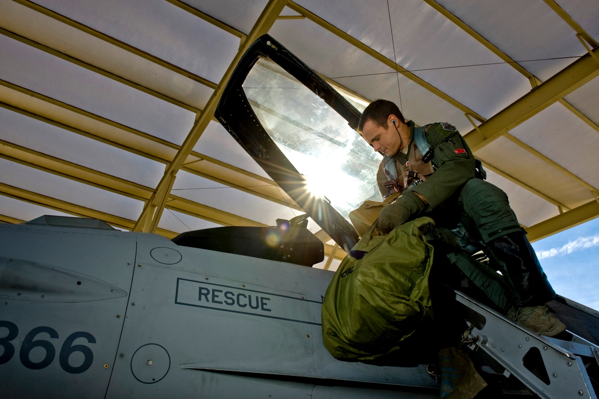 Lt. Col. Marshall Chalverus, 480th Fighter Squadron pilot from Spangdahlem Air Base, Germany, climbs into the cockpit of an F-16 Fighting Falcon during Red Flag 13-2 Jan. 22, 2013, at Nellis Air Force Base, Nev. This is the first time the 480th FS has been taking part in both Red Flag and Green Flag exercises at the same time. The squadron is participating in Red Flag 13-2 and Green Flag 13-3 until Feb. 1.  (U.S. Air Force photo by Senior Airman Daniel Hughes)