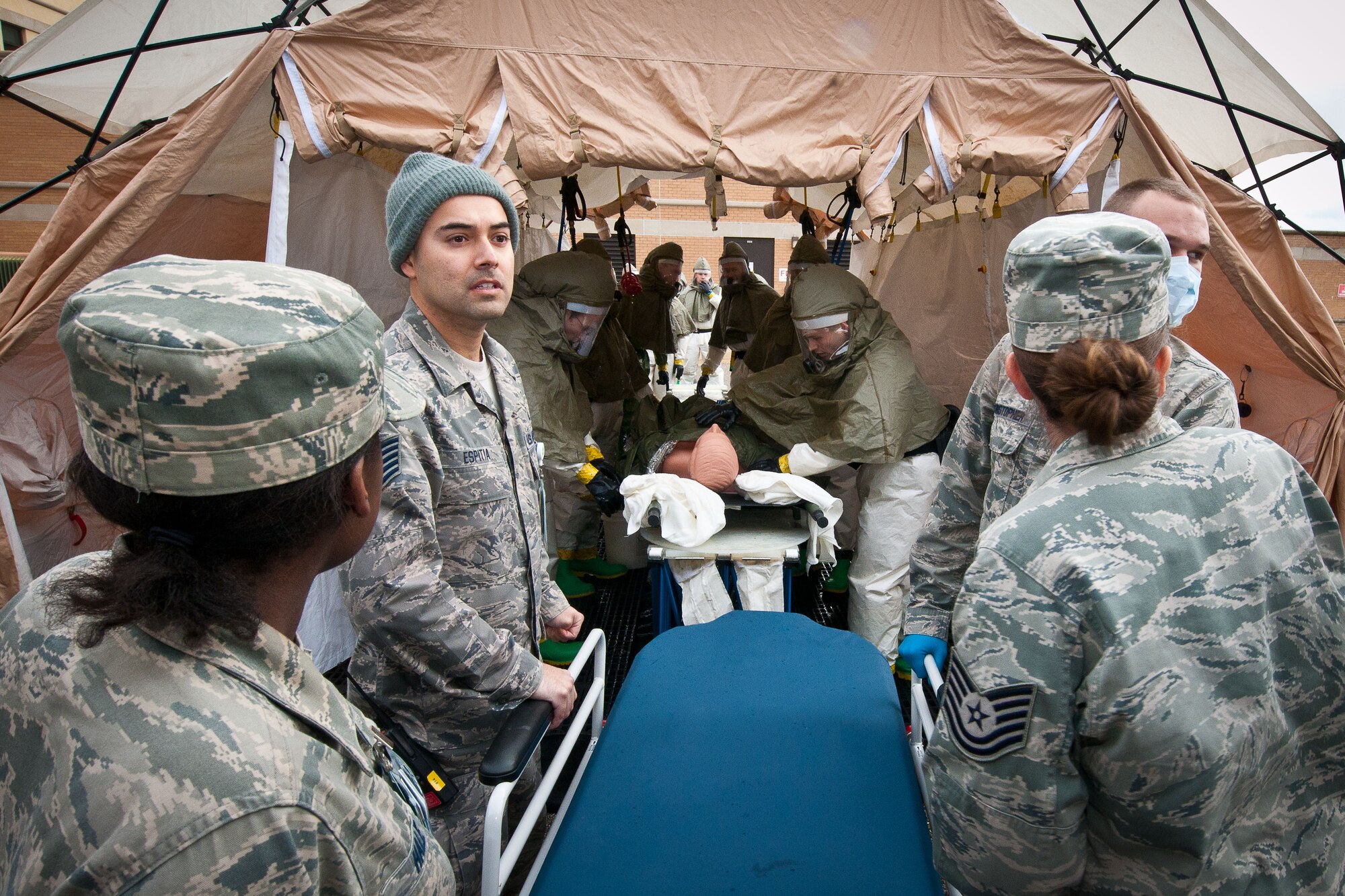 The triage team determines which patients are seen by the in-place decontamination team, which cleans the patients. The team must confirm the patients are decontaminated before the manpower and clinical team takes them to the clinic for evaluation. (U.S. Air Force photograph by Donna L. Burnett)