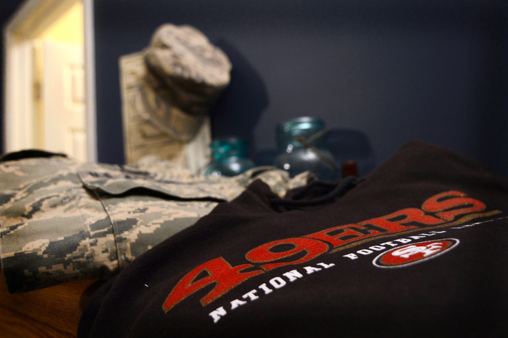A San Fransisco 49ers sweater sits next to U.S. Air Force Senior Airman Kevin Seney's  Airman Battle uniform, Jan. 28, 2013.   Seney, 20th Comptroller squadron finance technician, is a dedicated 49ers fan and anxiously awaits Super Bowl XLVII, Feb. 3, 2012.  The 20th Force Support Squadron  is scheduled to host a Super Bowl party, starting at 5 p.m., at the Carolina Skies Club and Conference Center the day of the big game.   (U.S. Air Force photo by Airman 1st Class Nicole Sikorski/Released)
