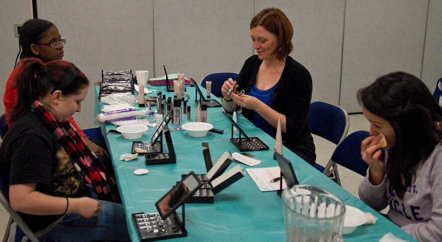 Spouses of deployed Airmen apply makeup during a spa day at Chapel 2 Jan. 25, 2013, at Dover Air Force Base, Del. It was an opportunity for Team Dover to offer the spouses a couple hours of relaxation, pampering, food and fellowship. (U.S. Air Force photo/Airman 1st Class Ashlin Federick)