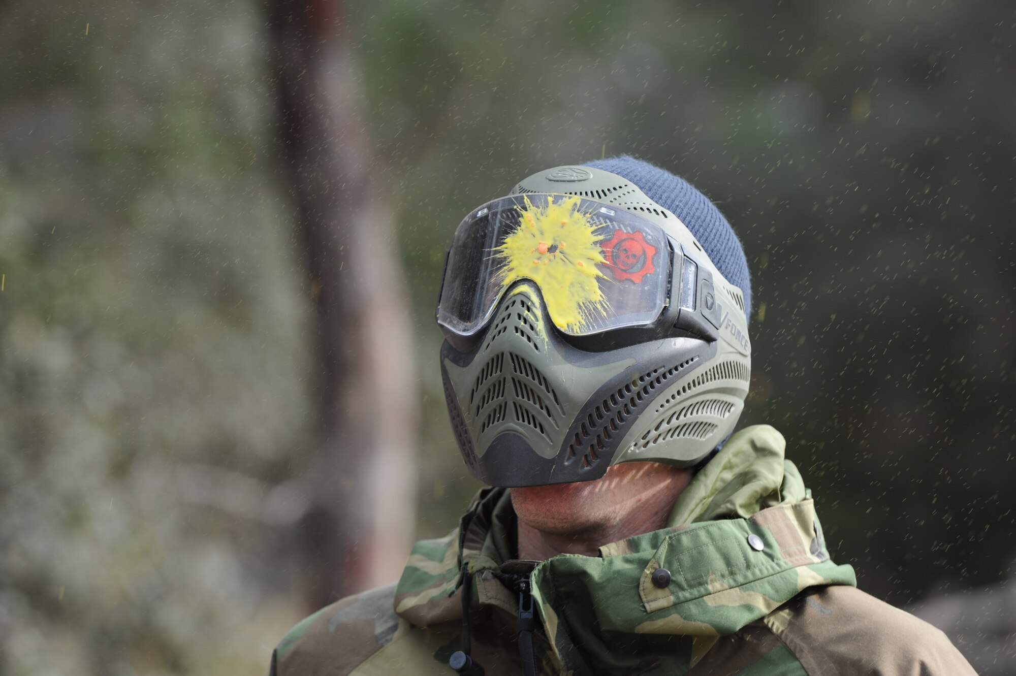 Robert Scott, director of the base community center, reacts as he is hit with a paintball during a paintball match at the base paintball field at Hurlburt Field, Fla., Jan. 25, 2013. Nearly 40 Airmen participated in the free paintball match provided by the community center. (U.S. Air Force photo / Senior Airman Joe McFadden)