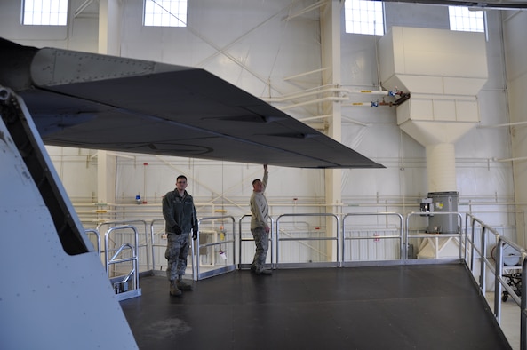 Master Sgt. Jason Lawson, right, and Airman 1st Class Mykal Short, left, both of the 507th maintenance squadron test the height of the new KC-135 maintenance platforms as they work their way around the wing of a Stratotanker. The new platforms are part of a package of platforms and stands that are expected to increase safety and decrease inspection times. (Photo by Senior Airman Mark Hybers) 
