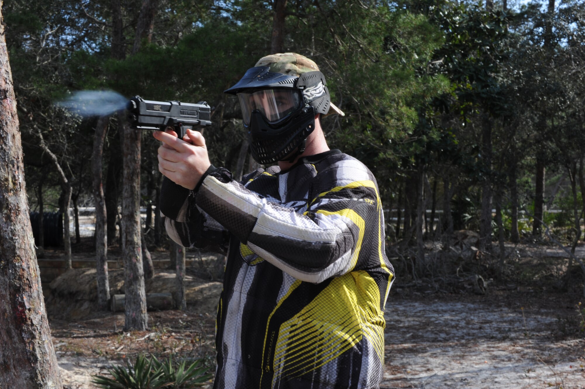 A Hurlburt Airman tests his air-powered paintball gun during a paintball match at the base paintball field at Hurlburt Field, Fla., Jan. 25, 2013. More than 40 Airmen used various types of paintball weapons during the free paintball challenge provided by the base community center. (U.S. Air Force photo / Senior Airman Joe McFadden)