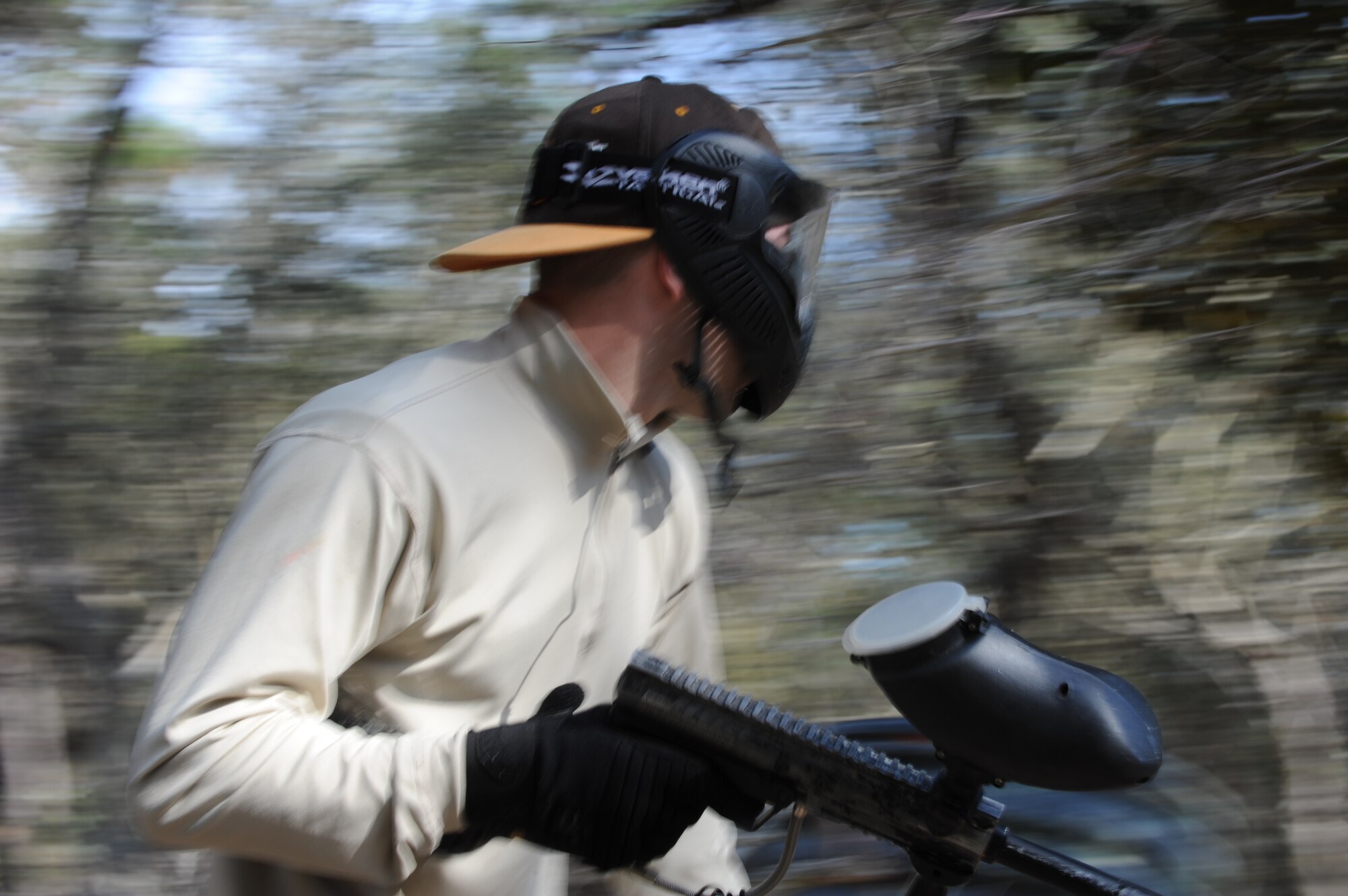 A Hurlburt Airman runs while participating in a paintball match at the base paintball field at Hurlburt Field, Fla., Jan. 25, 2013. More than 40 Airmen played in the free three-hour paintball challenge provided by the base community center. (U.S. Air Force photo / Senior Airman Joe McFadden)