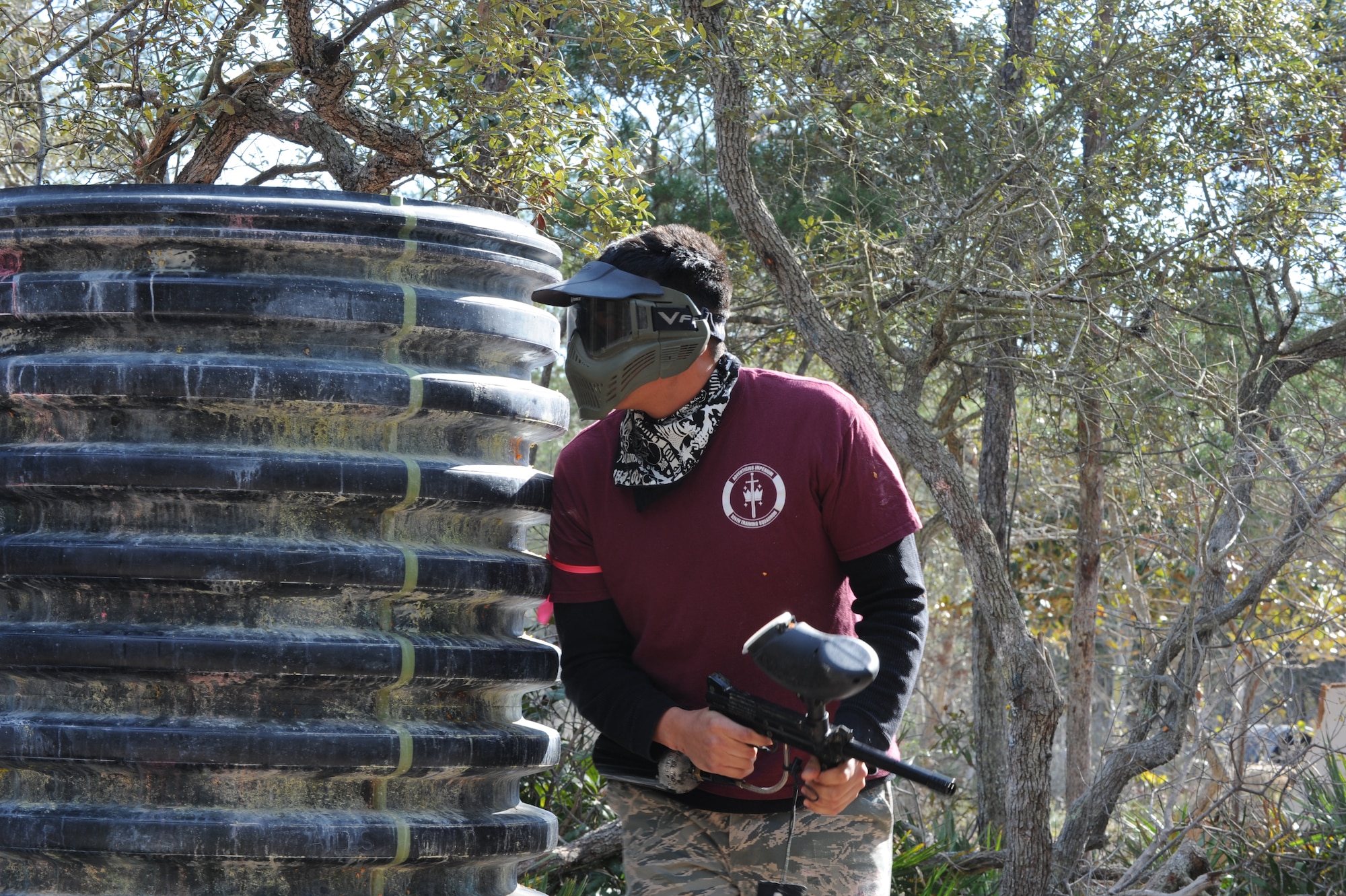 A Hurlburt Airman scans a perimeter while participating in a paintball match at the base paintball field at Hurlburt Field, Fla., Jan. 25, 2013. Airmen played in various matches, including capture-the-flag and civil war, in the free paintball challenge provided by the base community center. (U.S. Air Force photo / Senior Airman Joe McFadden)