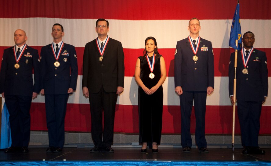 Nominees from the 23d Wing staff agency stand on stage as their names are announced at the 23d WG Annual Awards Banquet at the James H. Rainwater Conference Center in Valdosta, Ga., Jan. 25, 2013. Each nominee stood on stage as family and friends cheered when their names were announced. (U.S. Air Force Photo by Airman 1st Class Paul Francis/Released)

