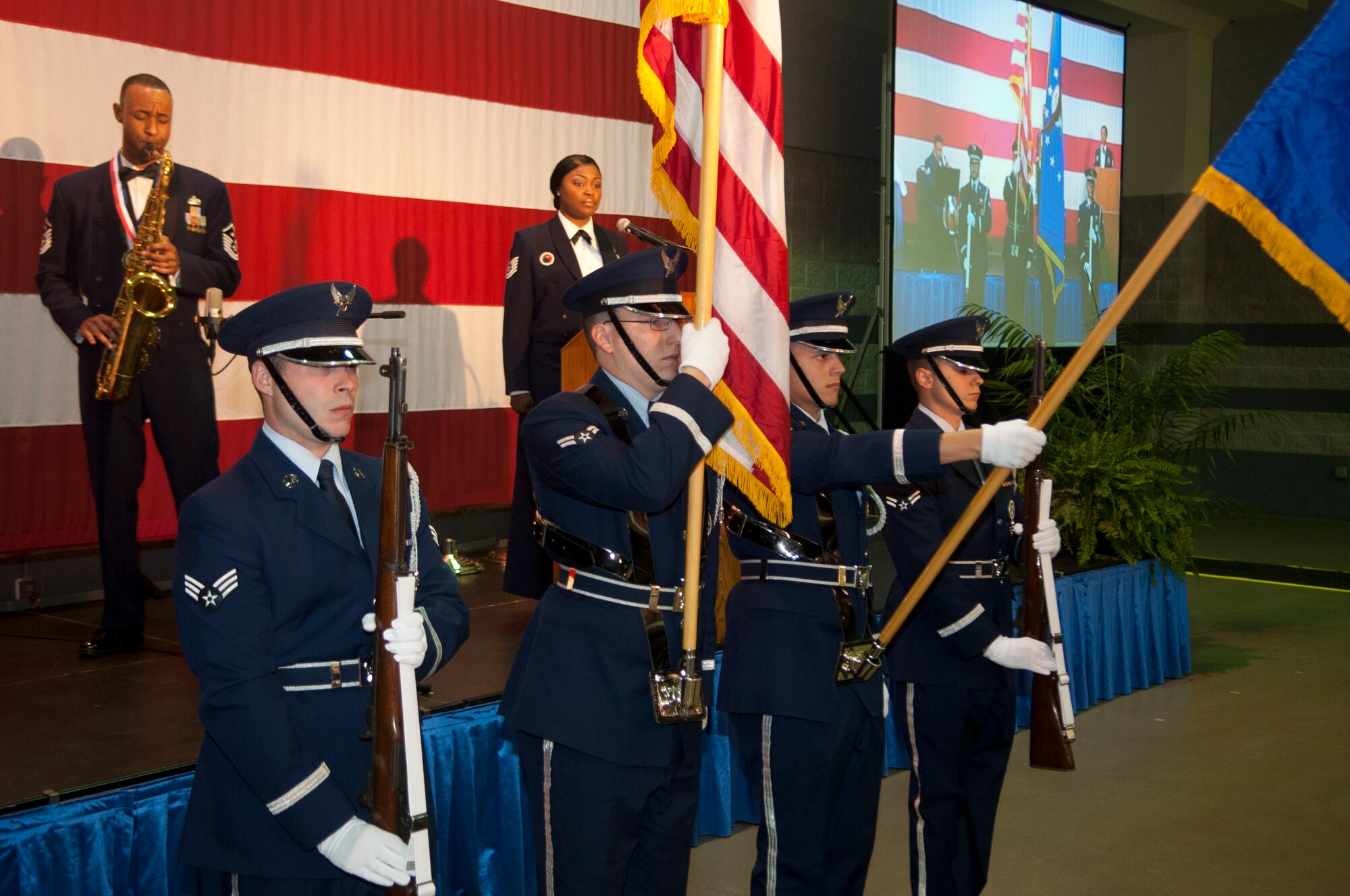 U.S. Air Force Master Sgt. Lomax Mabron, both of the 23d Medical Group, play the national anthem as Moody Air Force Base Honor Guard presents the colors during the 23d Wing 2012 Annual Awards Banquet at the James H. Rainwater Conference Center in Valdosta, Ga., Jan. 25, 2013. The banquet recognized members of the 23d Wing who went above and beyond what is required of them on a day-to-day basis. There were several nominees in each category, but only one was chosen as an annual award winner. (U.S. Air Force Photo by Airman Paul Francis/Released)
