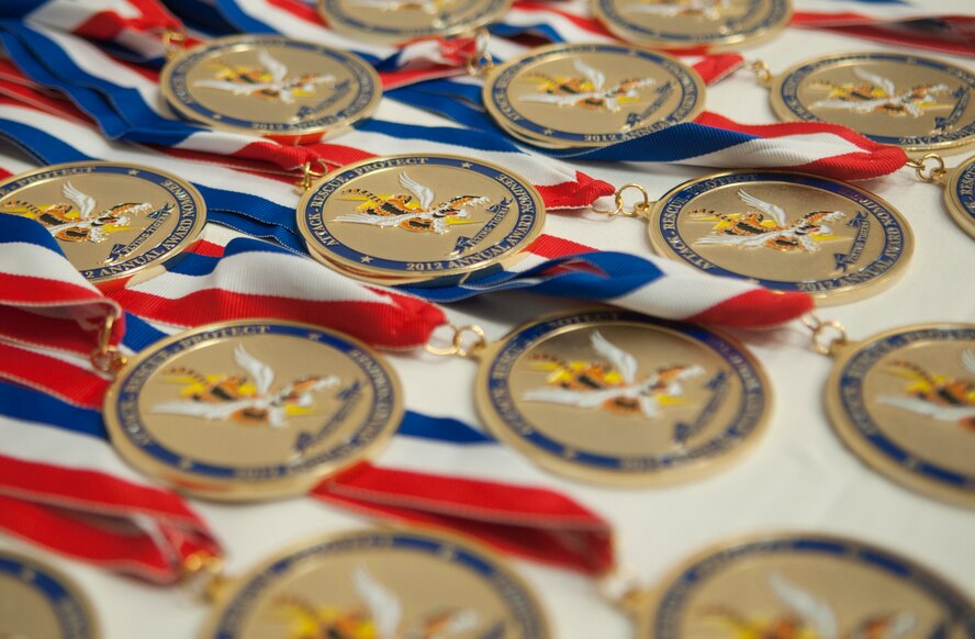 Medallions rest on a table during the 23d Wing 2012 Annual Awards Banquet at the James H. Rainwater Conference Center in Valdosta, Ga., Jan. 25, 2013. There were 51 nominees for the 2012 annual awards. (U.S. Air Force Photo by Airman Paul Francis/Released)
