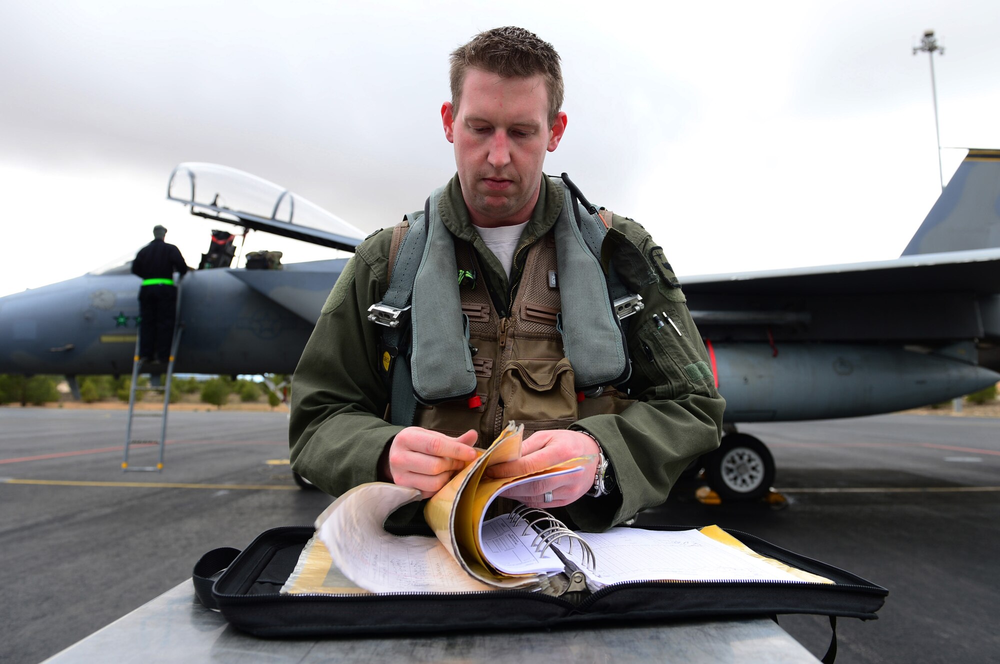 ALBACETE AIR BASE, Spain -- Capt. Aaron Schuett, 493rd Fighter Squadron chief of mobility, performs pre-flight checks prior to flying a training mission during the Tactical Leadership Program Jan. 18, 2013. The 493rd FS is participating in the multi-national program, which develops key leadership and mission planning skills needed for NATO operations. Based on his tactical and leadership ability, Schuett was chosen to be the squadron representative to go through the NATO-specific upgrade. (U.S. Air Force photo by Senior Airman Lausanne Morgan)