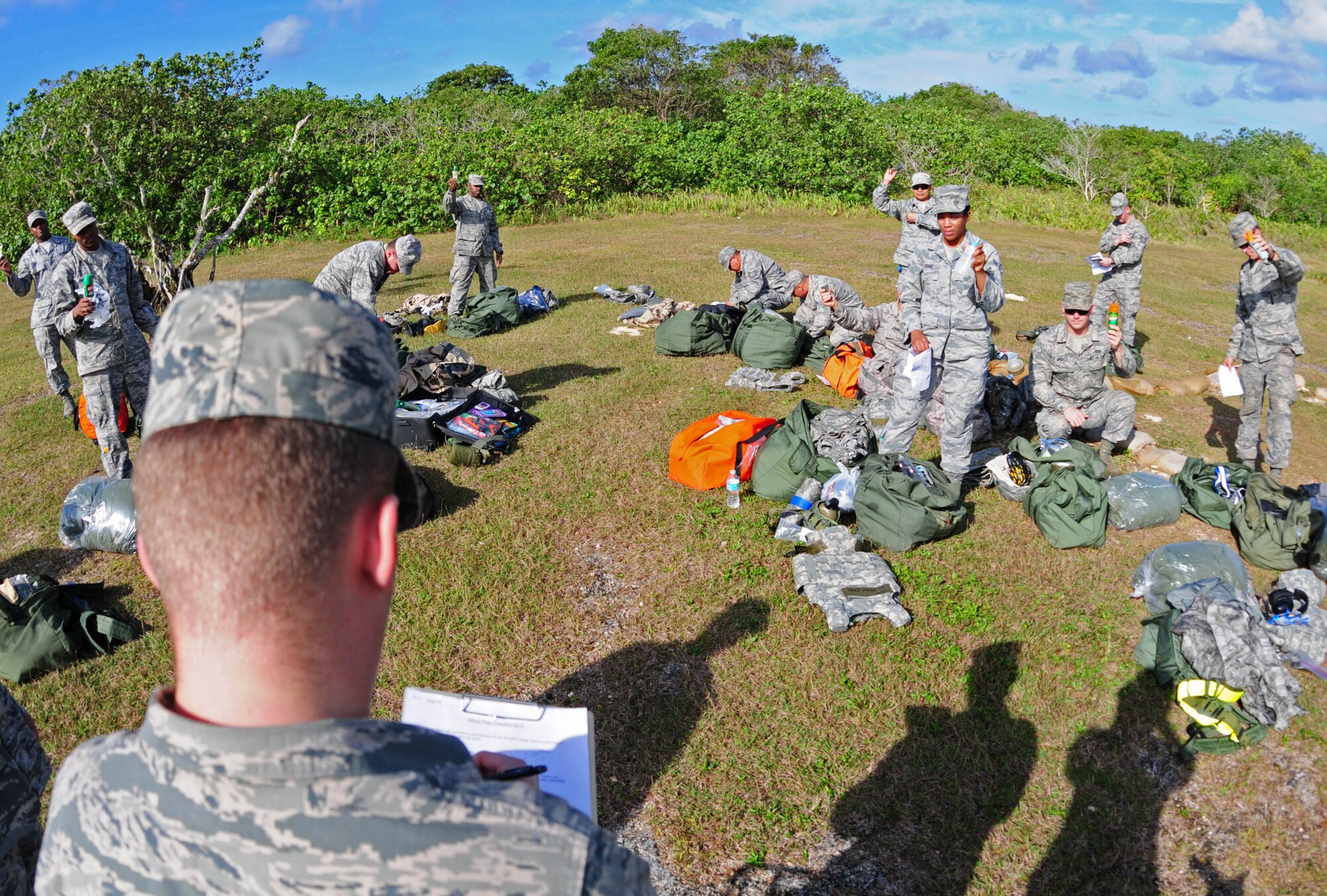 Airman 1st Class Keifer Roberts, 36th Civil Engineer Squadron readiness and emergency management flight instructor, enumerates the items that the 36th CES Airmen will need during a post attack reconnaissance chemical warfare training at Andersen Air Force Base, Guam, Jan. 28, 2013. The 36th CES readiness and emergency management flight’s primary mission is to manage programs that save lives, minimize the loss or degradation of resources and to sustain and restore operational capability through hazardous physical and environmental threats. (U.S. Air Force photo/Airman 1st Class Marianique Santos/Released)