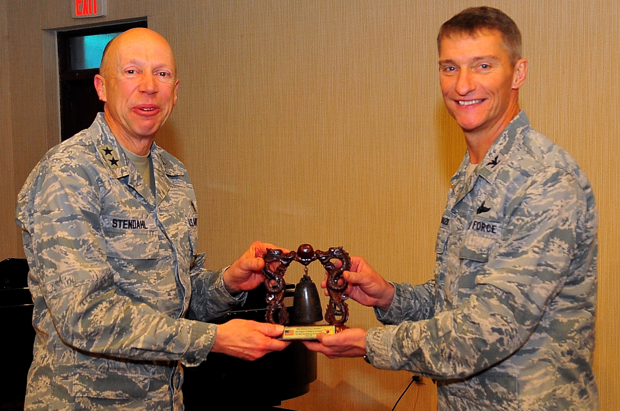 Col. Patrick McKenzie, right, 51st Fighter Wing commander, presents Chaplain (Maj. Gen.) Howard Stendhal, United States Air Force Chief of Chaplains, with a Korean Bell at the Officers Club on Osan Air Base, Republic of Korea, Jan. 28, 2013.  Stendhal was the guest speaker for this year’s National Prayer Breakfast. The National Prayer Breakfast was established in 1953 by President Dwight D. Eisenhower. (U.S. Air Force photo/Staff Sgt. Emerson Nuñez) 