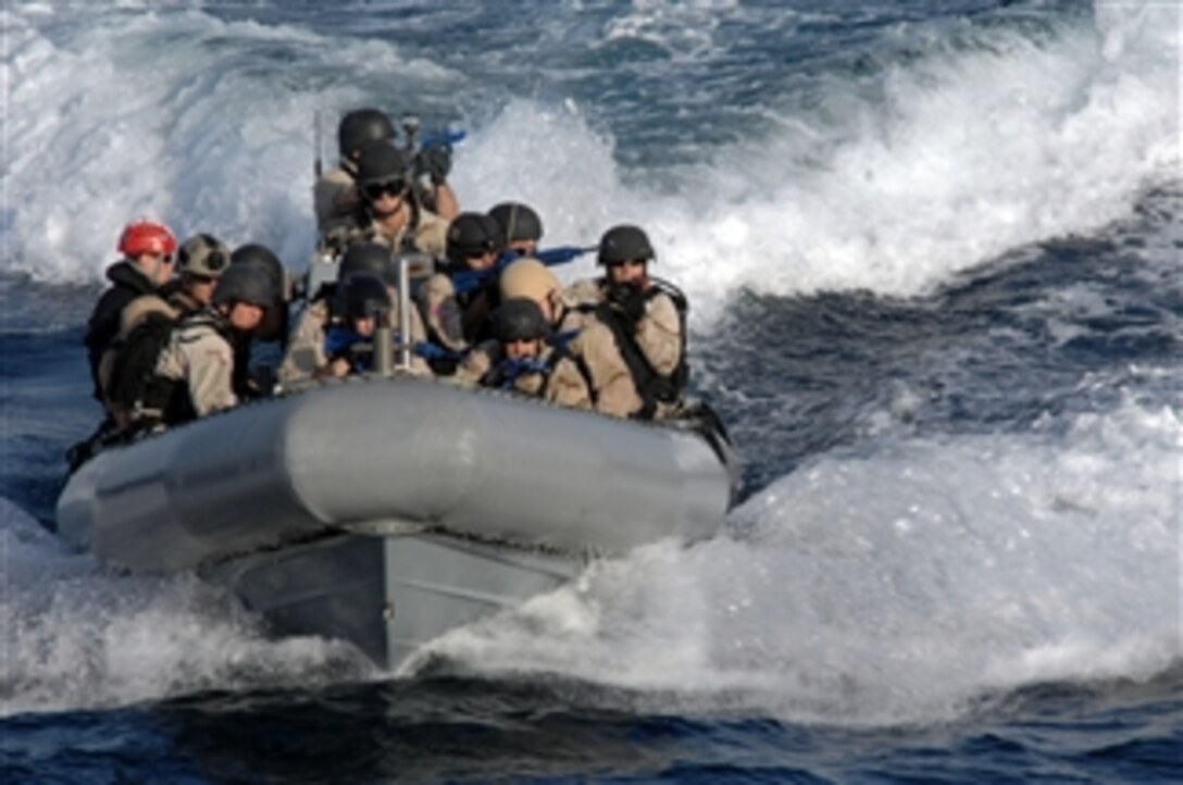 A U.S. Navy visit, board, search and seizure team from the guided-missile destroyer USS Farragut (DDG 99) rides in a rigid-hull inflatable boat during a training exercise on Jan. 18, 2013.  The Farragut is deployed with the John C. Stennis Strike Group to the U.S. 5th Fleet area of responsibility to conduct maritime security operations and theater security cooperation efforts.  
