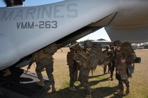 Marines with 8th Communications Battalion, II Marine Expeditionary Force, load into an MV-22B Osprey to be piloted by Marines with Marine Medium Tiltrotor Squadron 263 to a training center near Atlantic Beach, N.C., Jan. 23. VMM-263 Marines transported more than 30 Marines during this field training exercise.