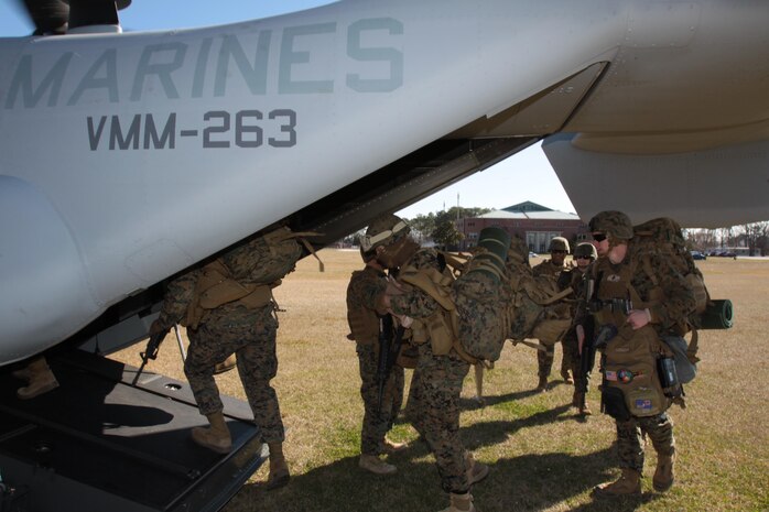 Marines with 8th Communications Battalion, II Marine Expeditionary Force, load into an MV-22B Osprey to be piloted by Marines with Marine Medium Tiltrotor Squadron 263 to a training center near Atlantic Beach, N.C., Jan. 23. VMM-263 Marines transported more than 30 Marines during this field training exercise.