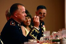 Lt. Col. Daniel J. Bradley, the commander of Combat Logistics Battalion 24, 2nd Marine Logistics Group, grimaces before bites into a piece of beef covered in hot sauce during the unit’s mess night aboard Camp Lejeune, N.C., Jan. 25, 2013. Bradley fought through the burning sensation of a sauce fittingly named The Reaper before declaring the meat ready for the guests in attendance.