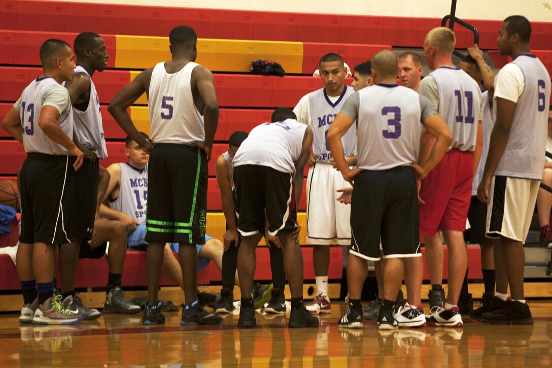 MARINE CORPS BASE HAWAII — Players from the Headquarters Battalion intramural basketball team gather to discuss strategy during a game against Postal at Semper Fit, Jan. 22. (U.S. Marine Corps photo by Lance Cpl. Suzanna Lapi/Released)


 
