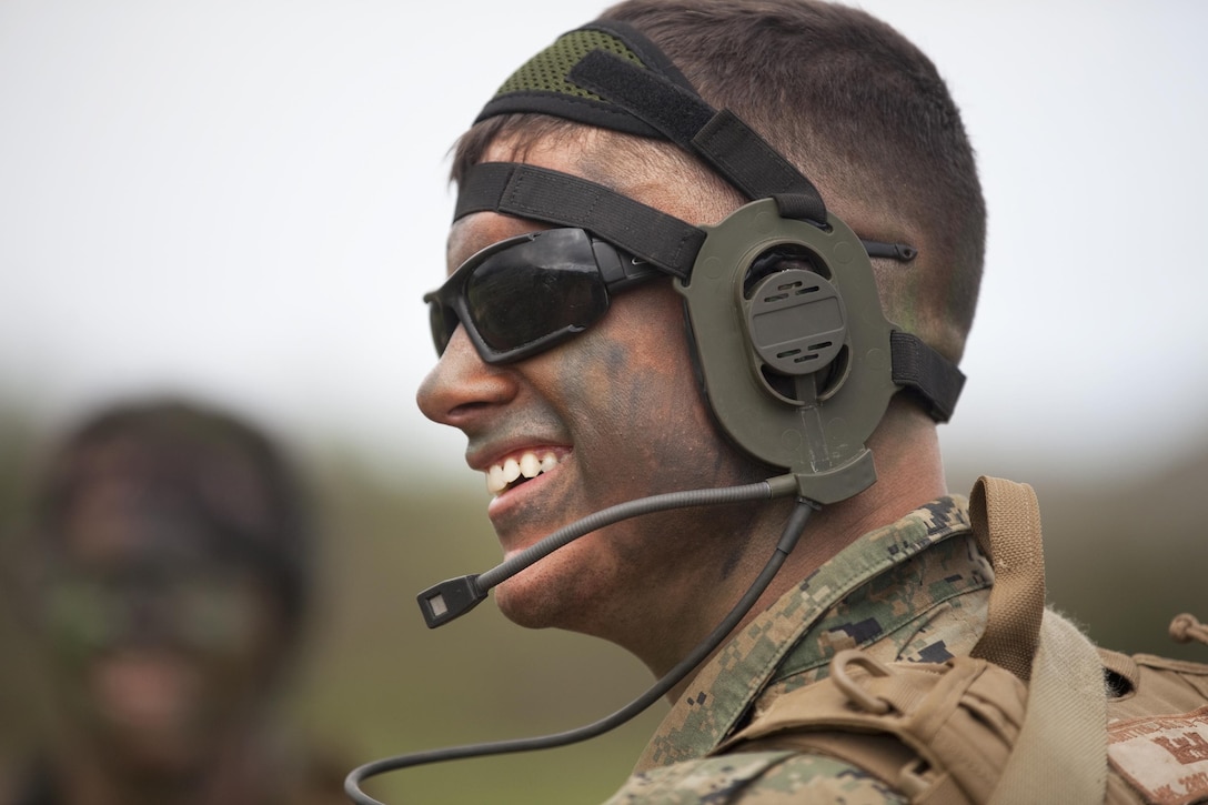 MARINE CORPS TRAINING AREA BELLOWS, Hawaii — Lance Cpl. Brandon Klawitter, a combat engineer with Combat Assault Company, 3rd Marine Regiment, and native of Tacoma, Wash., talks to his squad leader after a security patrol during a command post exercise at Marine Corps Training Area Bellows, Jan. 23. (U.S. Marine Corps photo by Lance Cpl. Jacob D. Barber/Released)
