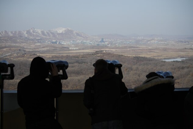 Tourists use binoculars to peer into North Korea on the Mt. Dora Observatory Jan. 26, 2013. The observatory is part of the Korean Demilitarized Tour, which stops by all the main tourist attractions up to the Military Demarcation Line.