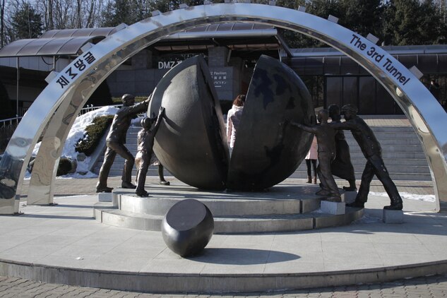 A monument dedicated to reunification and peace sits outside the entrance to the 3rd Infiltration Tunnel, which is part of the Korean Demilitarized Zone tour, which stops by all the main tourist attractions up to the
Military Demarcation Line.