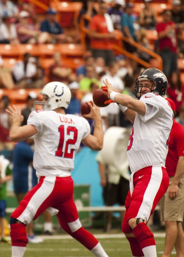 Denver Broncos quarterback Peyton Manning warms up with rookie Pro Bowler and Indianapolis Colts quarterback Andrew Luck at Aloha Stadium before the 2013 NFL Pro Bowl, Jan. 27. Luck replaced Manning as Colts quarterback last year, but both took their team to the playoffs and were selected to the Pro Bowl for their superior performance.