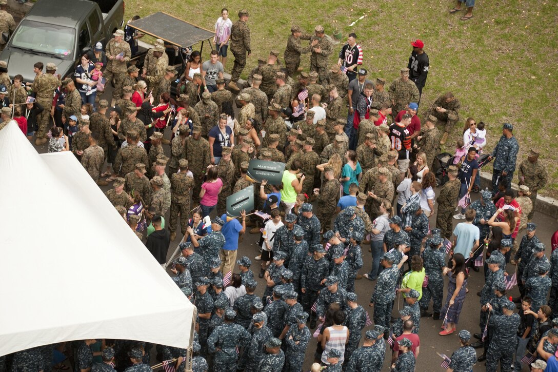 Hawaii-based Marines, Sailors and their families check in before they make their halftime appearance during the NFL Pro Bowl at Aloha Stadium, Jan. 27. The Marines who participated in the halftime show recently returned from deployment. 