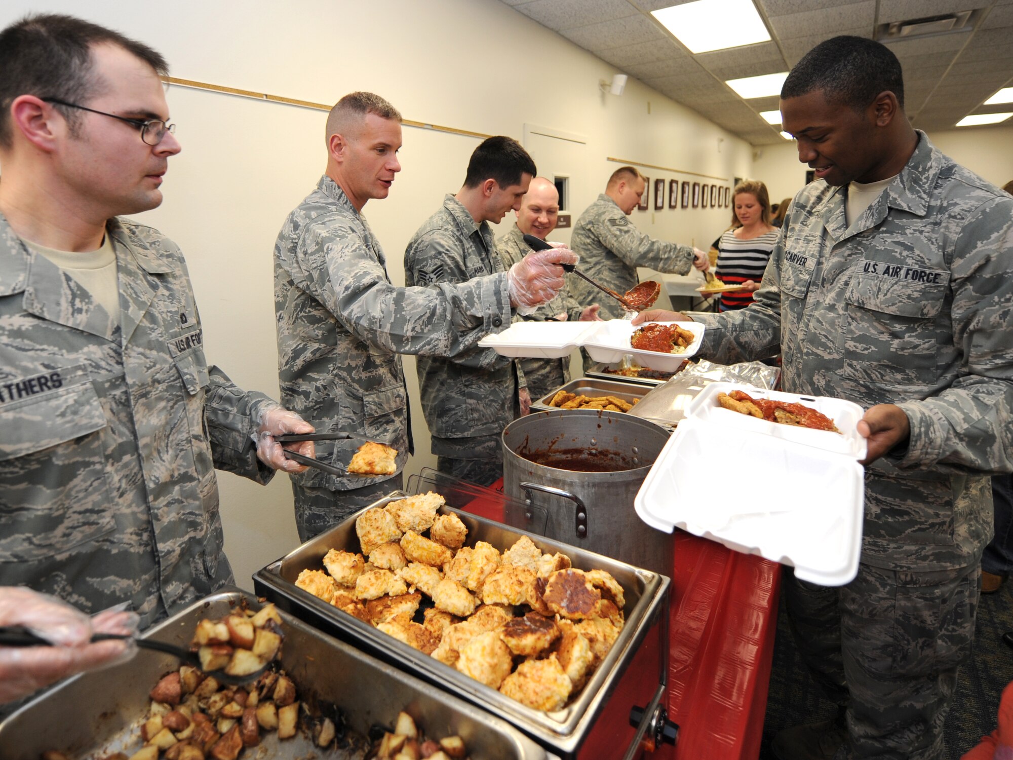 The 71st Mission Support Group hosted the monthly Singles’ International Gourmet Meal Opportunity Jan. 28, at Vance Air Force Base, Okla. Thirty-three volunteers served 136 dinners, to single Airmen and the families of deployed Airmen, in the Community Chapel Activity Center. (U.S. Air Force photo/ Airman 1st Class Frank Casciotta)