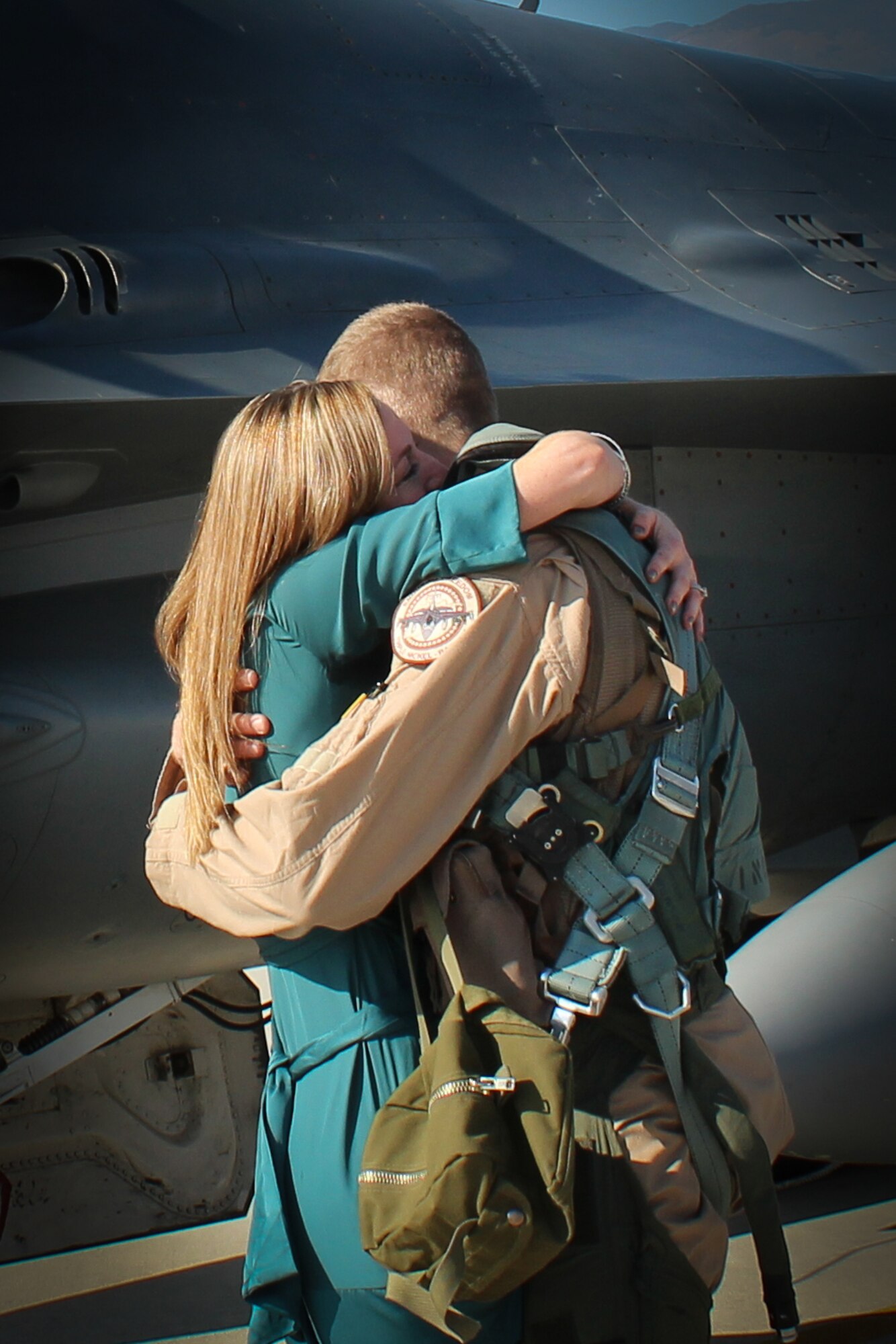 Cassy Gruenther embraces her husband, Capt. Lucas Gruenther, 31st Fighter Wing chief of flight safety, after returning from a deployment in 2011. Gruenther, 32, has been missing since officials at Aviano Air Base lost contact with the captain’s F-16 fighter jet Jan. 28 during a nighttime training mission over the Adriatic Sea.
