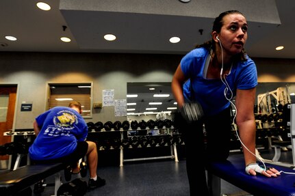 Staff Sgt. Crystal Housman, 628th Air Base Wing command chief executive, lifts a dumbell Jan. 17, 2013, at Joint Base Charleston - Air Base, S.C. Housman prefers to perform her physical training in the morning before taking on her duties of the day. (U.S. Air Force photo/ Staff Sgt. Rasheen Douglas)