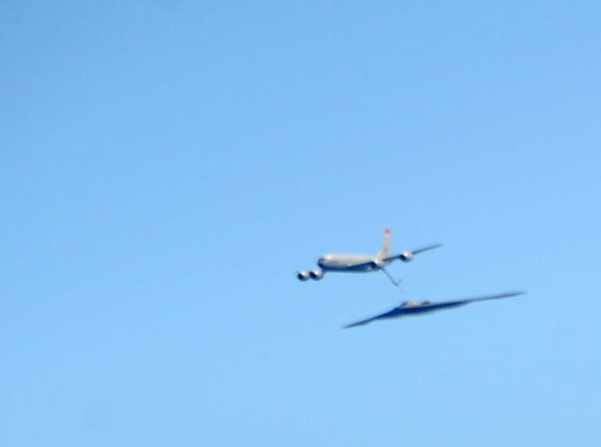 ANDERSEN AIR FORCE BASE, Guam -- A B-2 Spirit stealth bomber is refueled in-flight by a KC-135 on Jan. 23, 2013, over the Pacific Ocean. Two B-2 crews from the 509th Bomb Wing, Whiteman AFB, Mo., flew training missions out of Andersen AFB, Guam in support of in-theater training objectives.  (U.S. Air Force photo/Airman 1st Class Brooke P. Doyle)