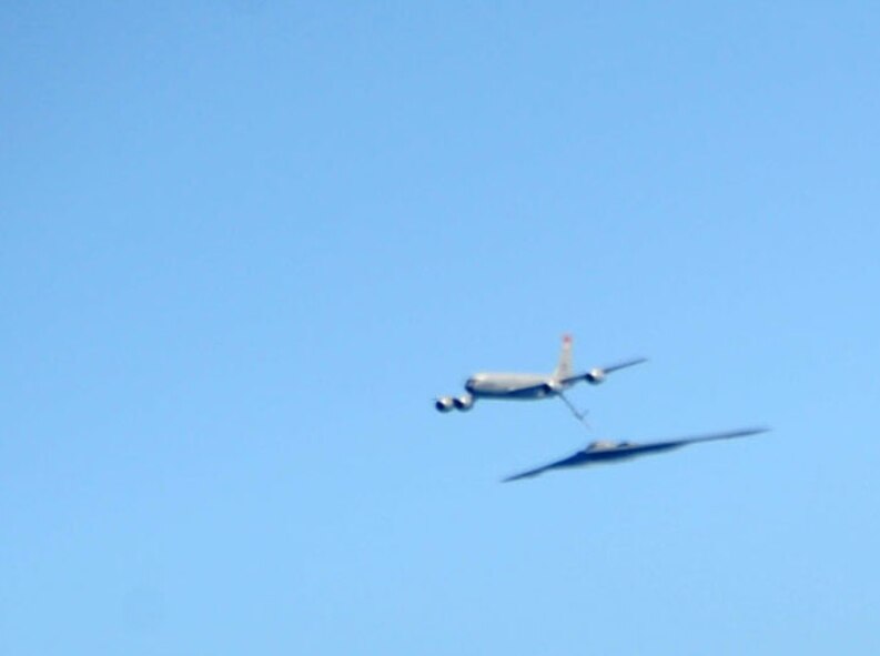 ANDERSEN AIR FORCE BASE, Guam -- A B-2 Spirit stealth bomber is refueled in-flight by a KC-135 on Jan. 23, 2013, over the Pacific Ocean. Two B-2 crews from the 509th Bomb Wing, Whiteman AFB, Mo., flew training missions out of Andersen AFB, Guam in support of in-theater training objectives.  (U.S. Air Force photo/Airman 1st Class Brooke P. Doyle)