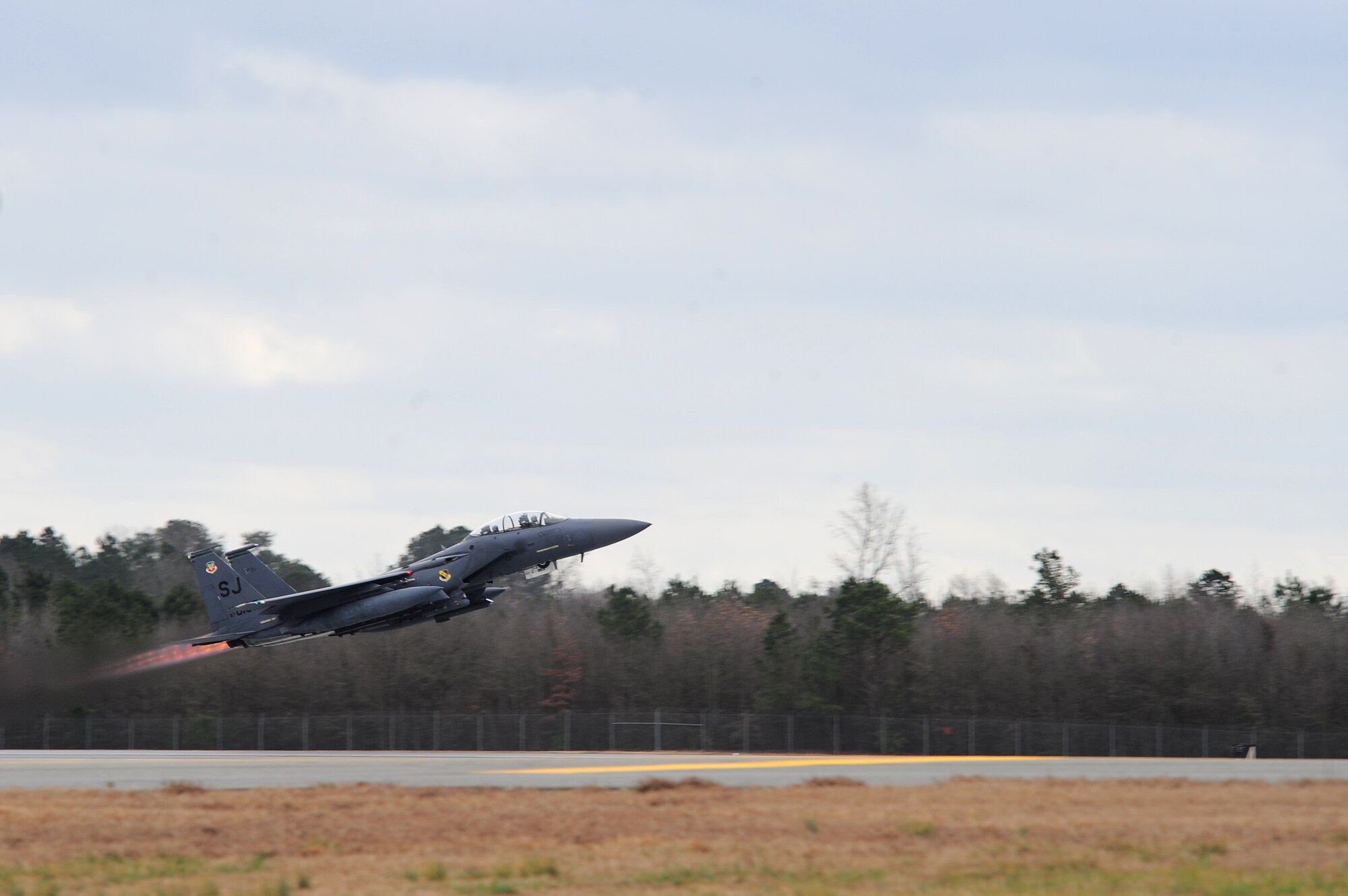 An F-15E Strike Eagle takes flight during Operational Readiness Exercise Coronet Warrior 13-01B, at a simulated deployed location on Seymour Johnson Air Force Base, N.C., Jan. 30, 2013. Numerous aircraft were generated in response to simulated threats made against the base during the ORE. (U.S. Air Force photo/Airman 1st Class Aubrey White/Released)