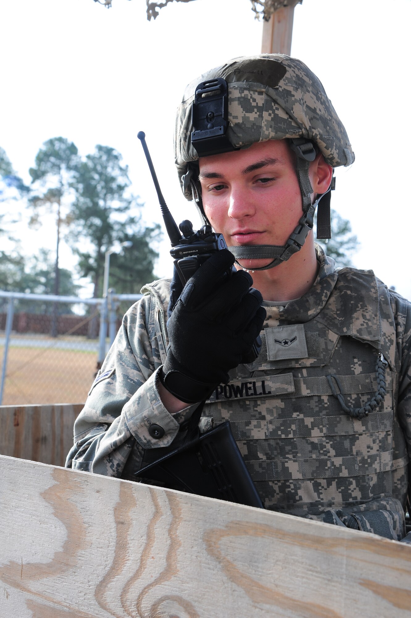 U.S. Air Force Airman Dylan Powell, 4th Security Forces Squadron patrolman, reports suspicious behavior during Operational Readiness Exercise Coronet Warrior 13-01B, at a simulated deployed location on Seymour Johnson Air Force Base, N.C., Jan. 30, 2013. Simulated hostile forces tested 4th SFS personnel’s ability to react to an attempted entry control breach. (U.S. Air Force photo/Airman 1st Class Aubrey White/Released)