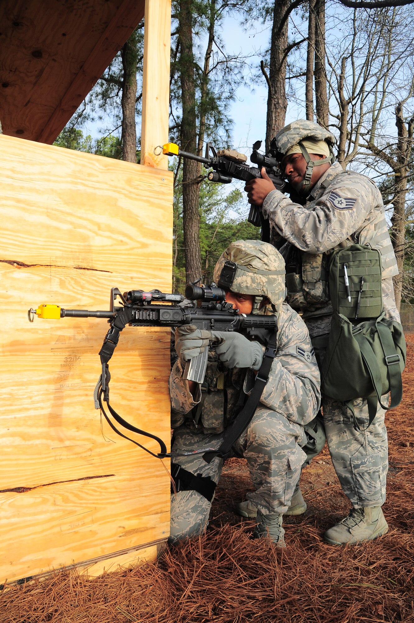 U.S. Air Force Staff Sgt. Cordarius Lewis and Airman 1st Class Michael Mandel, 4th Security Forces Squadron patrolmen, scan the horizon for possible threats during Operational Readiness Exercise Coronet Warrior 13-01B, at a simulated deployed location on Seymour Johnson Air Force Base, N.C., Jan. 30, 2013. Security forces personnel are responsible for keeping an eye out for suspicious activity and defending the base during the ORE. (U.S. Air Force photo/Airman 1st Class Aubrey White/Released)