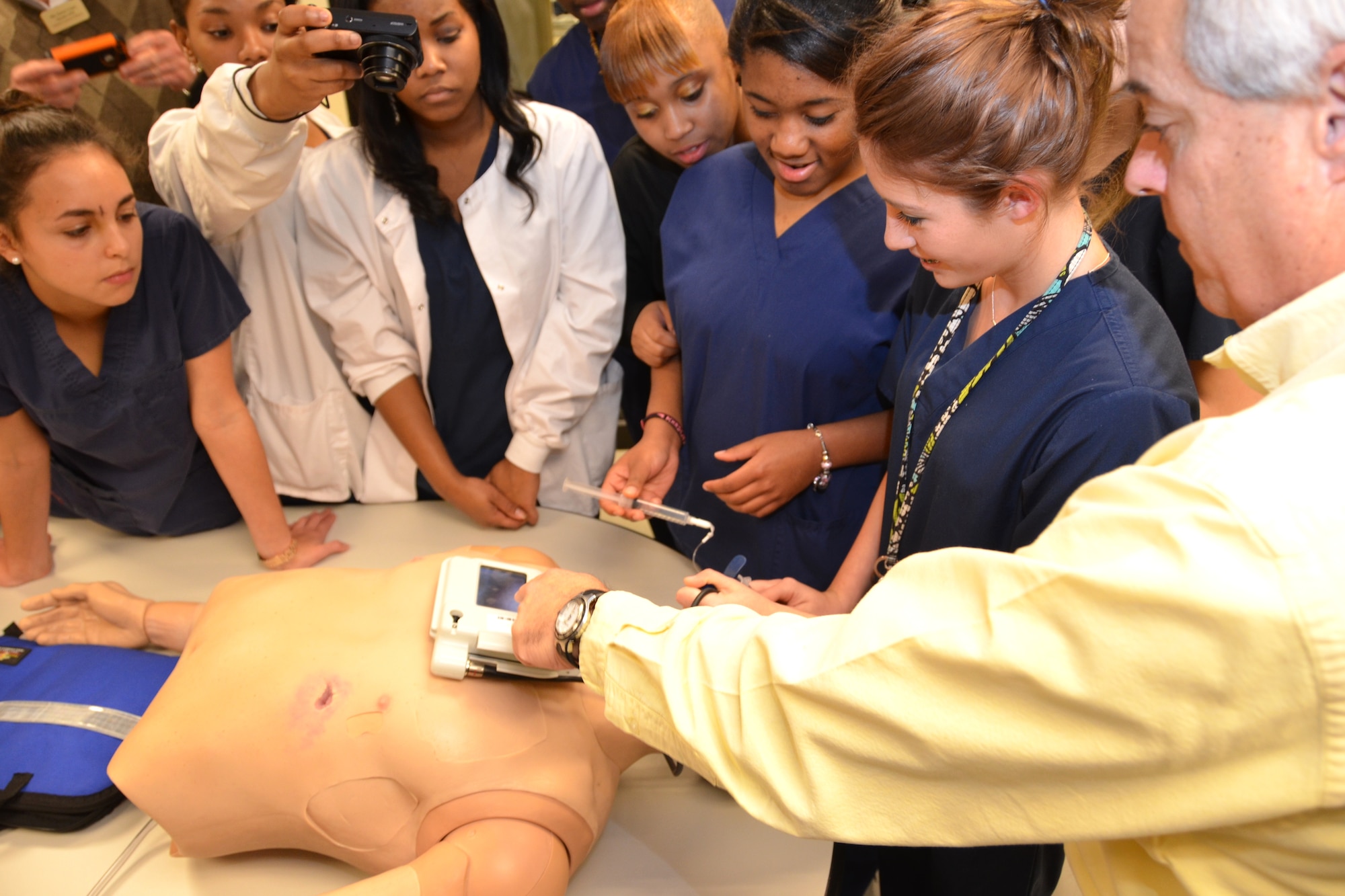Simulation Lab coordinator Randy Bernhardt, right, explains how to intubate a patient to members of the Gautier High School allied health class visiting the Keesler Hospital Jan. 25, 2013 at Keesler Air Force Base, Miss.  The 81st Medical Group Simulation Lab was just one area the group of 40 students and chaperones had the opportunity to see during their tour.  (U.S. Air Force photo by Steve Pivnick)