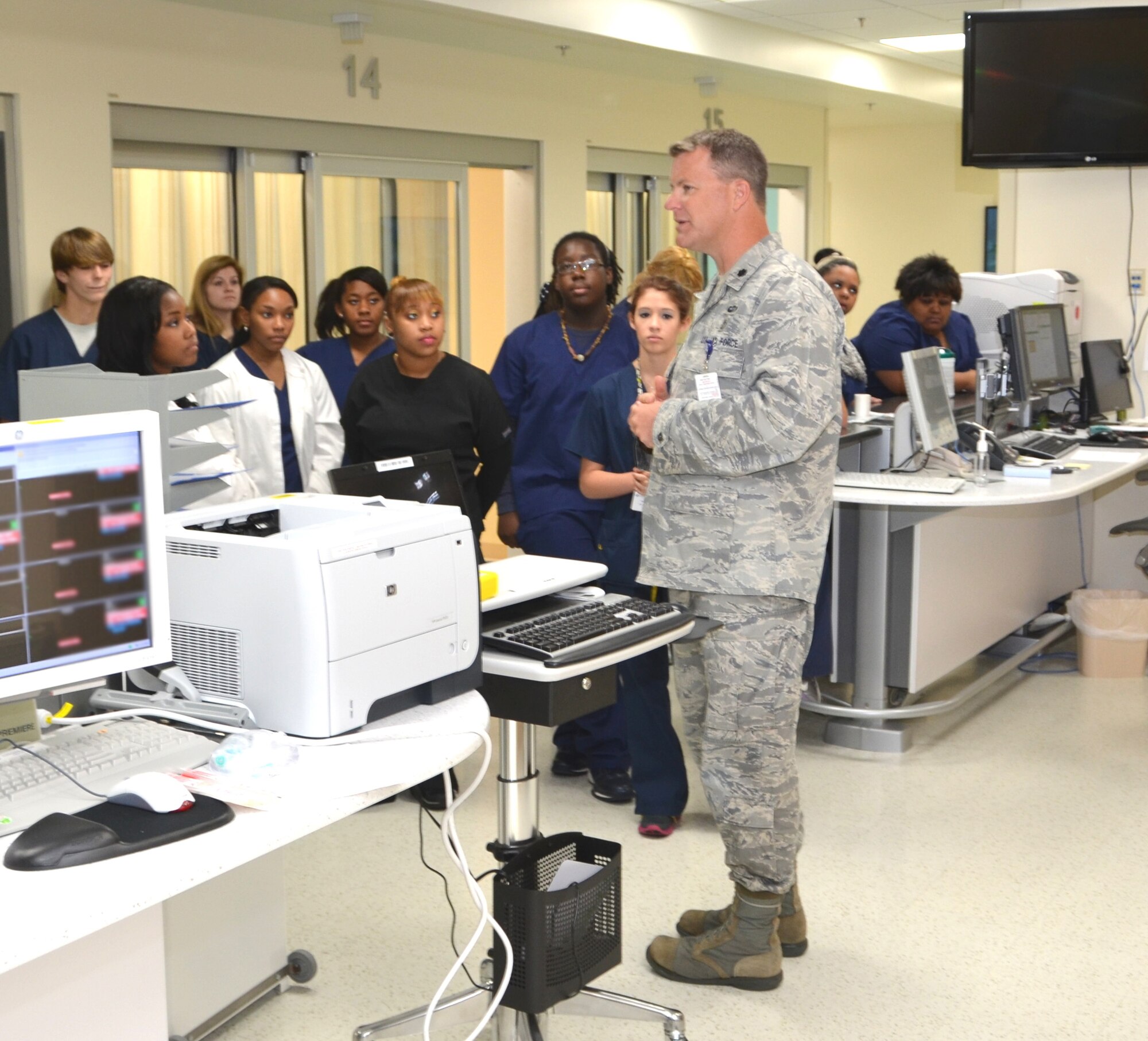 Lt. Col. (Dr.) Joseph Pocreva, right, describes the operation of the Keesler Hospital’s Emergency Department to members of the Gautier High School allied health class during a hospital visit, Jan. 25, 2013.  The 81st Medical Operations Squadron Emergency Services Flight commander explained how the ER staff cares for patients, many of whom may spend as little as 20 minutes in the department before being discharged.  The ER was just one area the group of 40 students and chaperones had the opportunity to see during their tour.  (U.S. Air Force photo by Steve Pivnick)